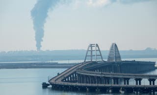 File photo: A view across the Kerch Strait shows smoke rising above a fuel depot near the Crimean bridge
