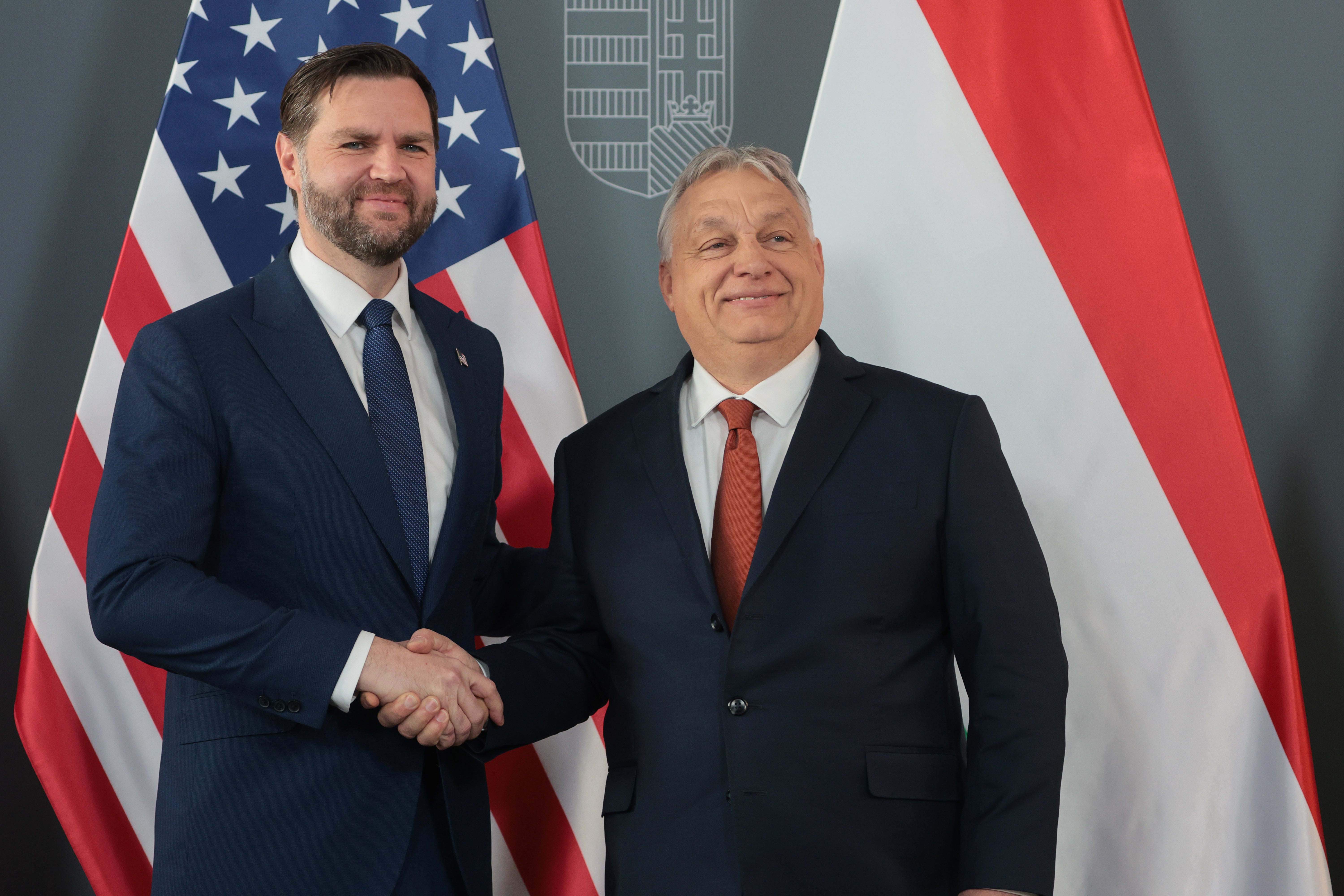 Orbán, right, shakes hands with Vance, in Budapest, Hungary