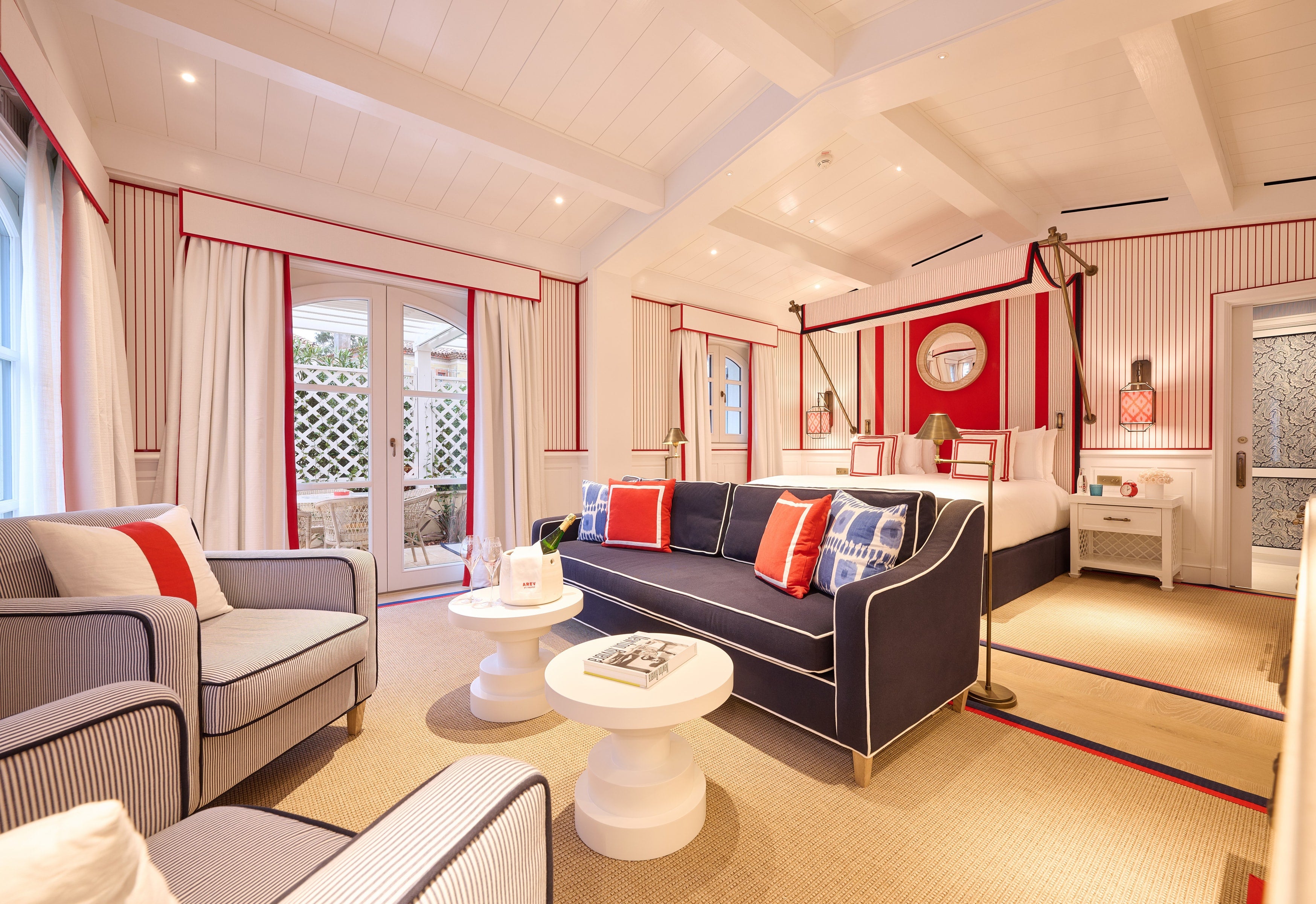 The stylish suites and villas boast premium four-poster beds and beautifully designed en suites