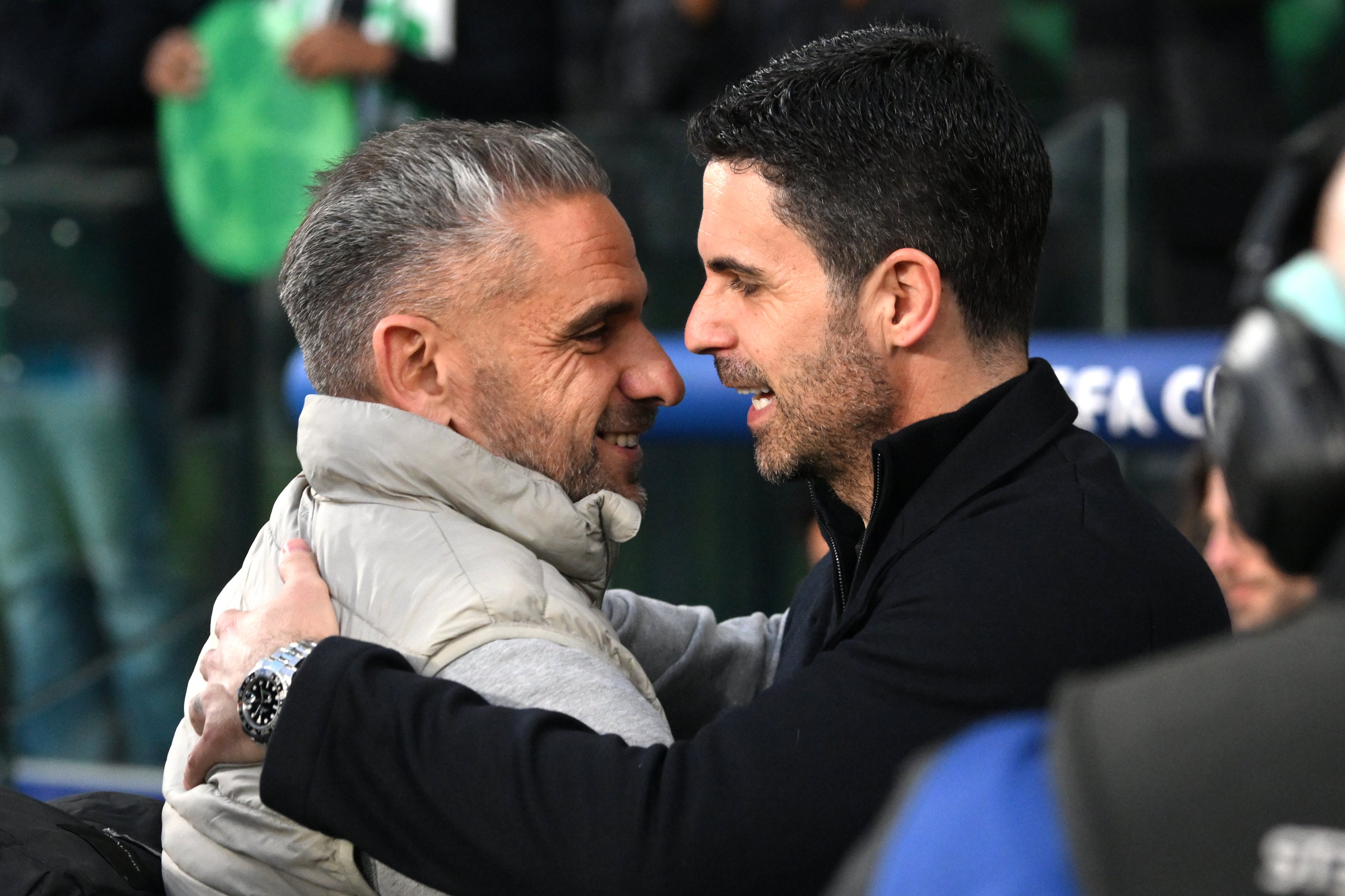 Arsenal manager Mikel Arteta (right) hugs Sporting Lisbon head coach Rui Borges (Zed Jameson/PA)
