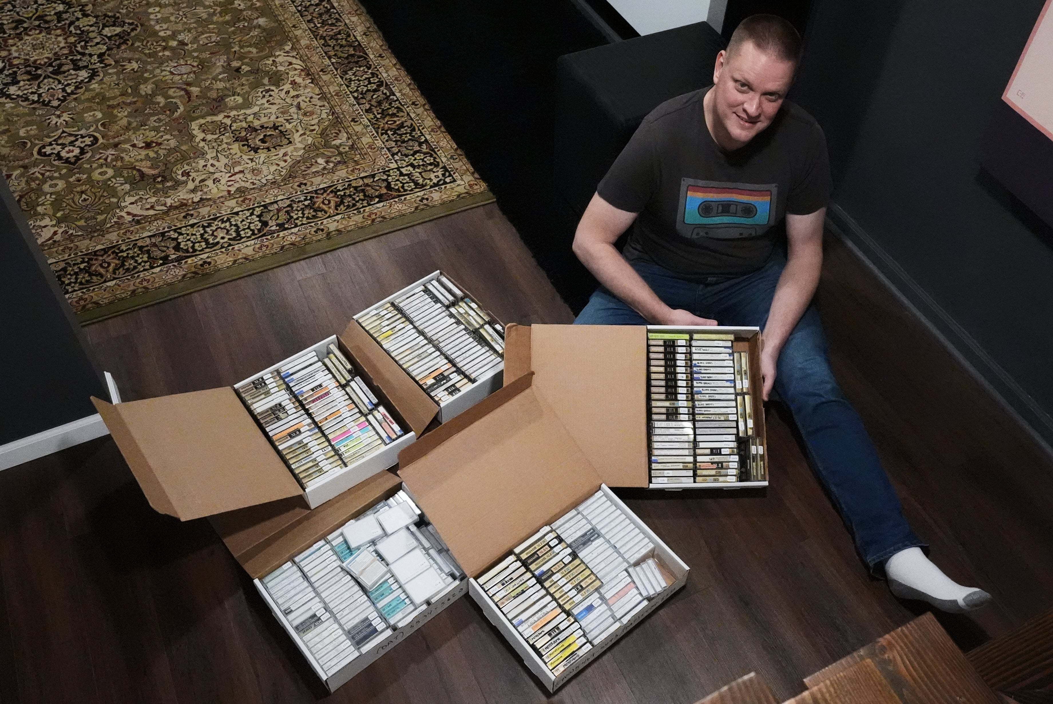 Brian Emerick poses with his recorded tapes