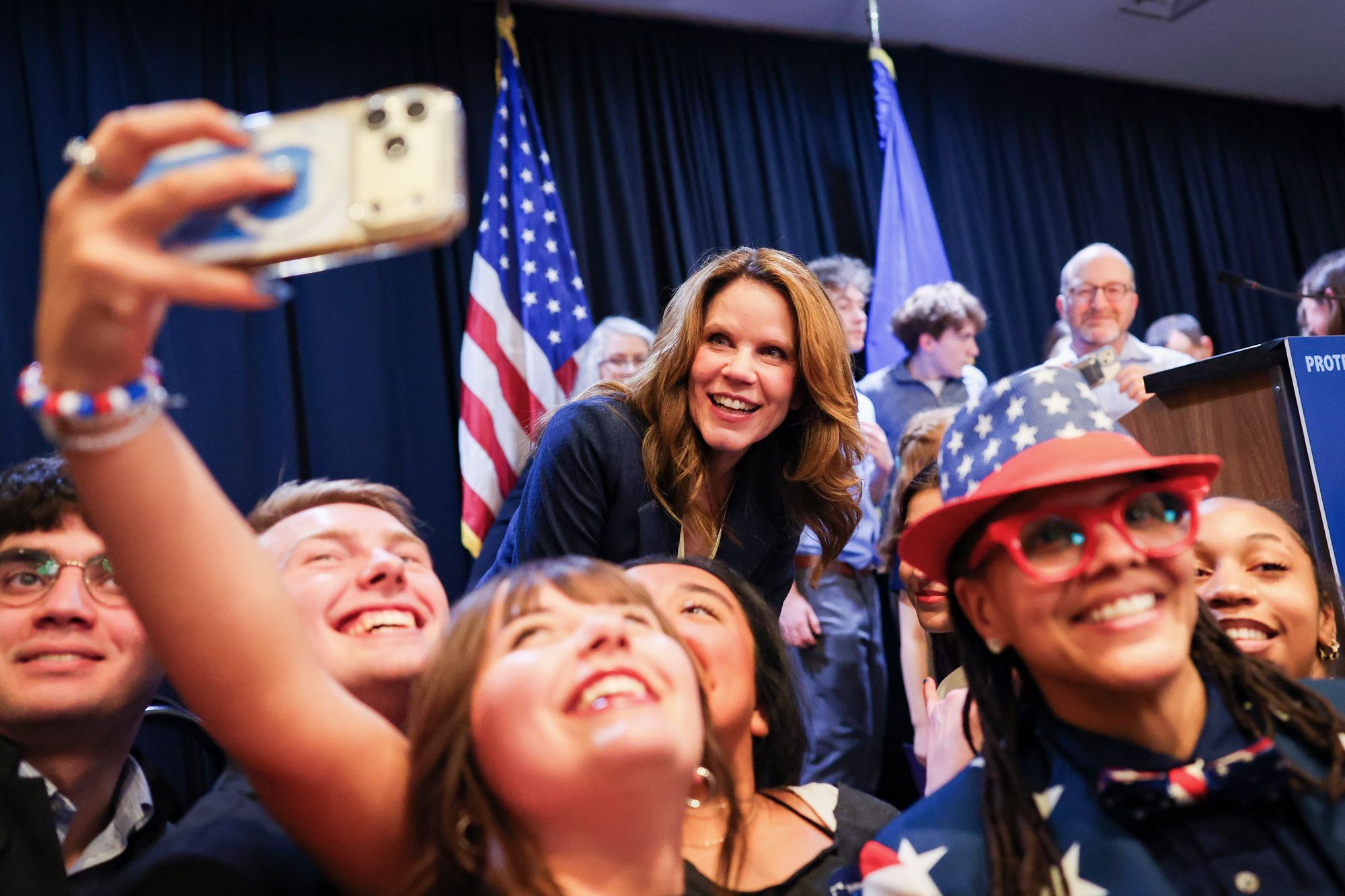 Wisconsin State Supreme Court Justice-elect Chris Taylor takes a picture with constituents after speaking on Tuesday, April 7, 2026, in Madison