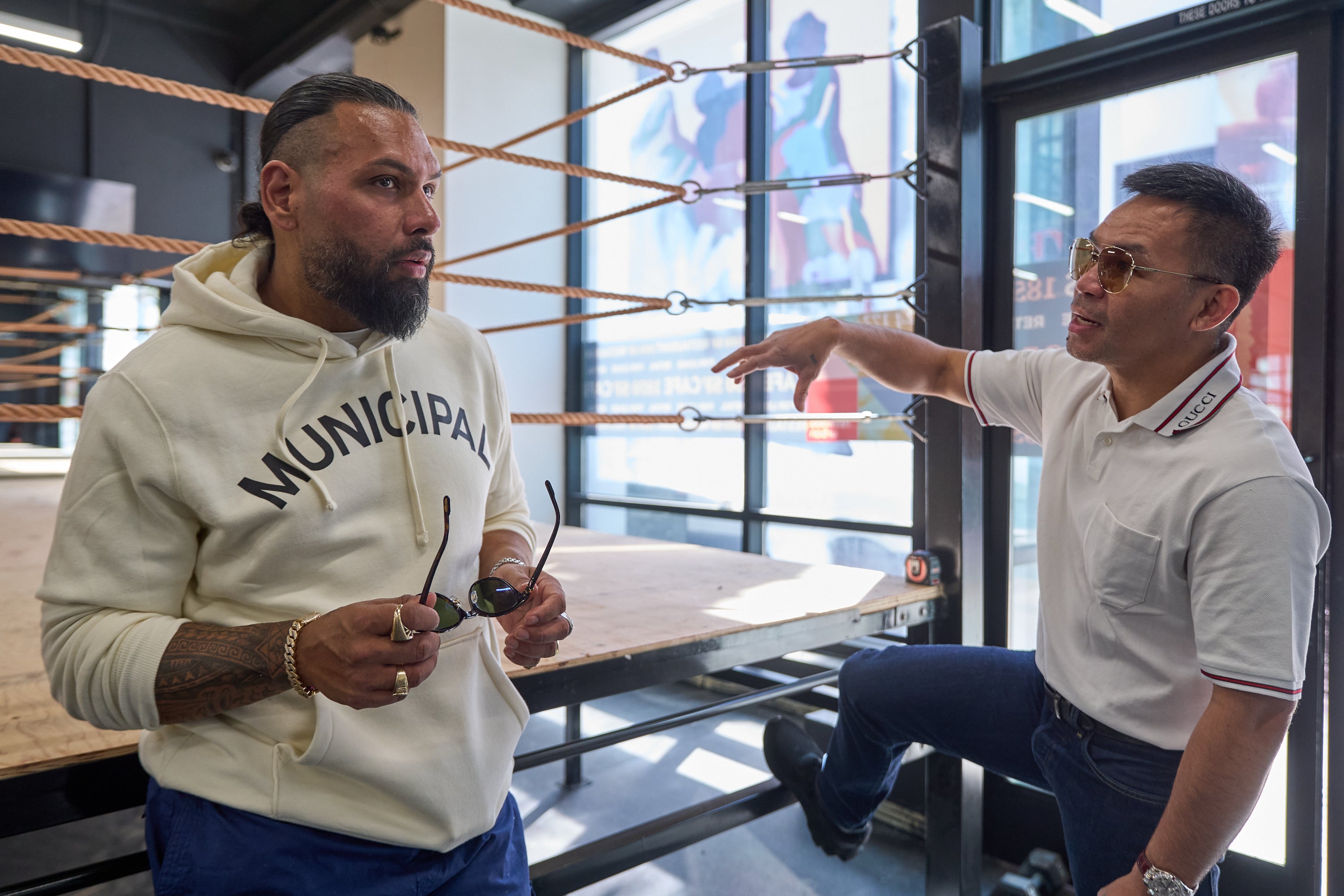 Jas Mathur, CEO of Manny Pacquiao Promotions, left, and boxer Manny Pacquiao tour the new 