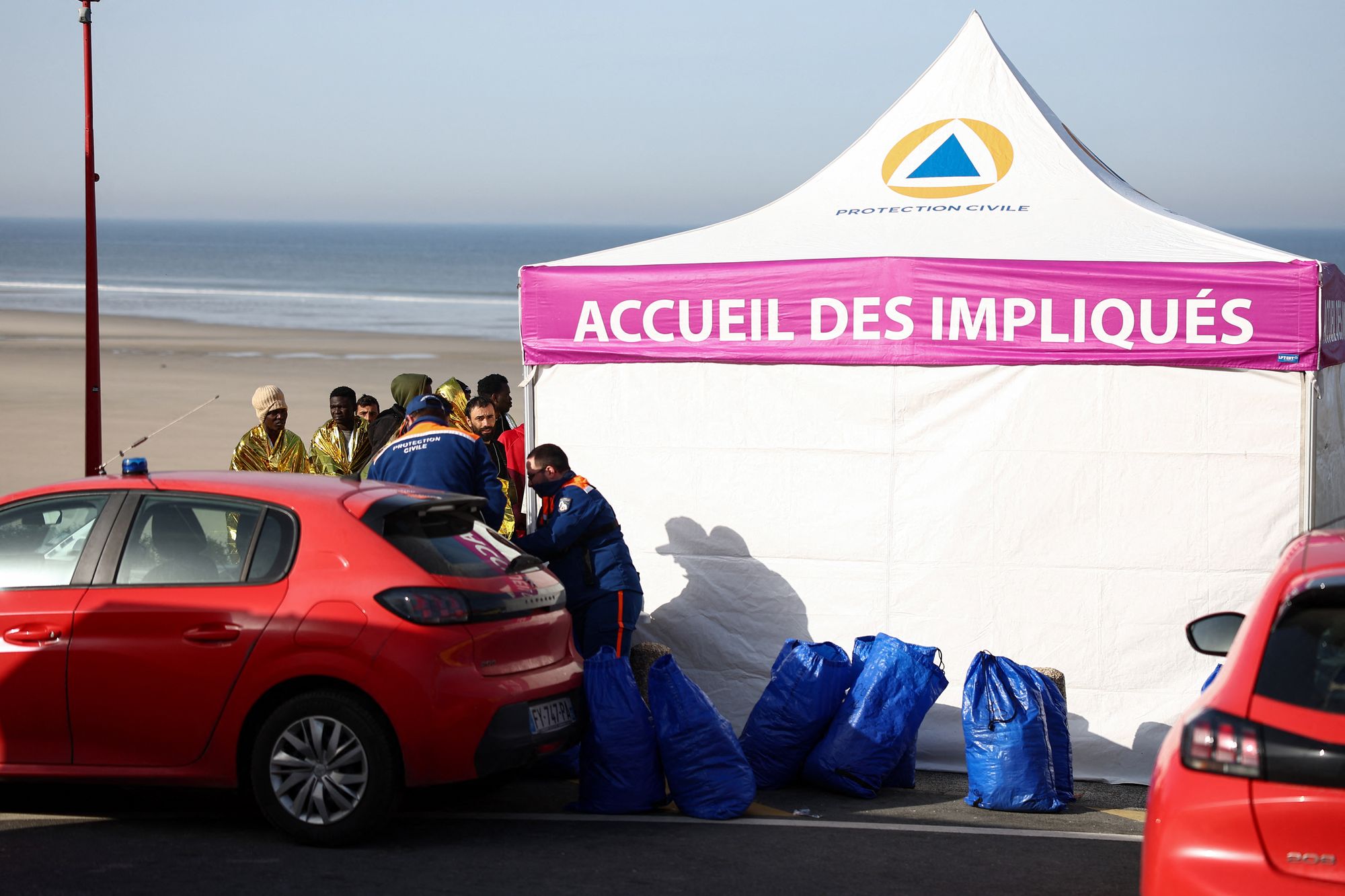 Rescue units handle victims after an attempt to cross the English Channel illegally turned tragic with several migrants found in cardiac arrest, in France's Pas-de-Calais northern coastal city of Equihen-Plage on April 9, 2026.