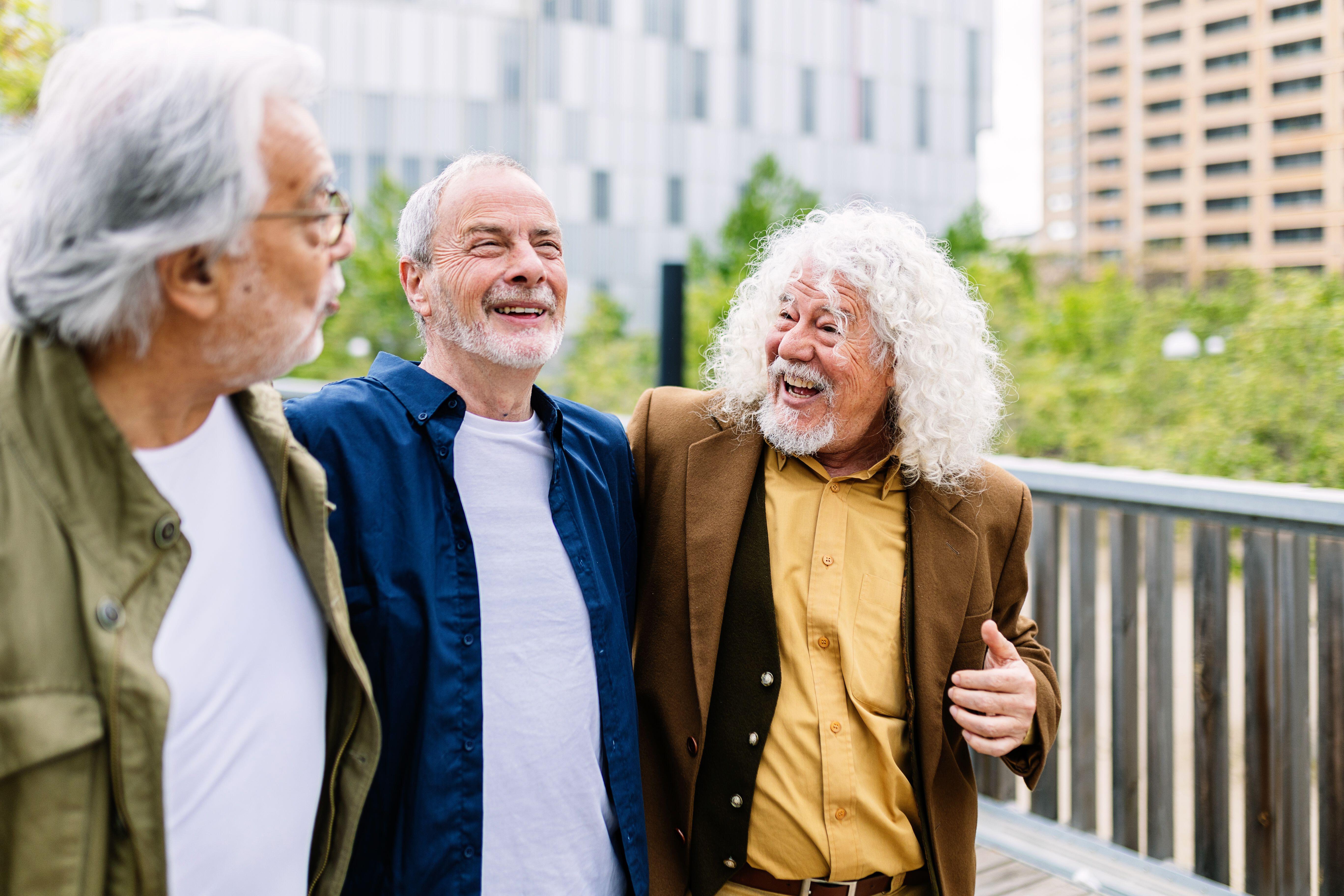 Three happy senior men walking outdoors (Alamy/PA)