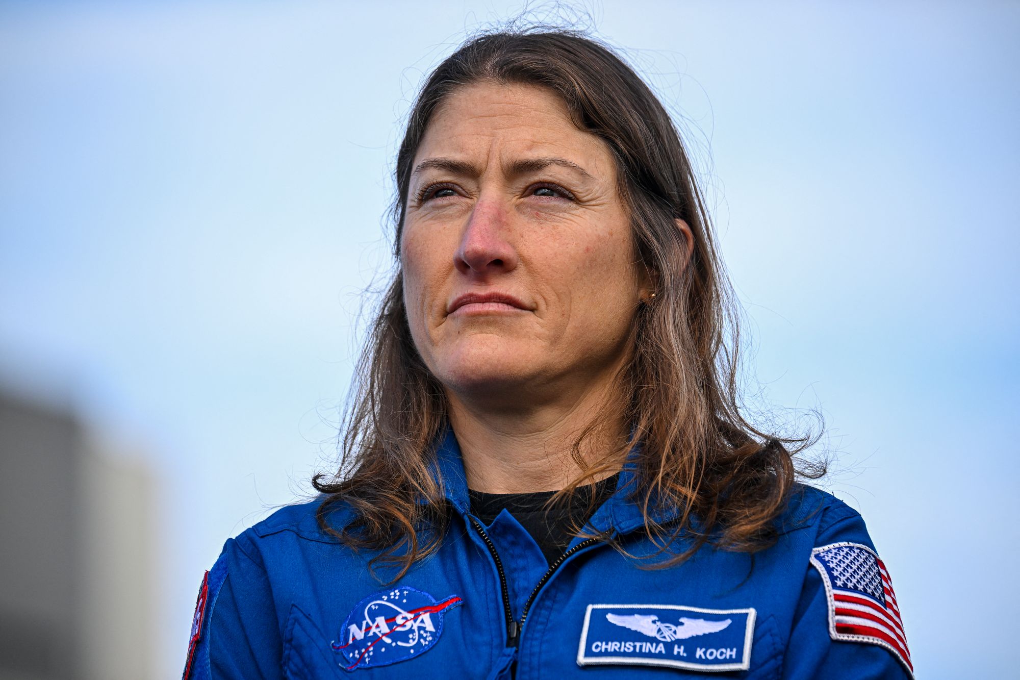 NASA astronaut Christina Koch looks on during the rollout of the Space Launch System rocket and the Orion crew in January 2025 at Florida’s Kennedy Space Center