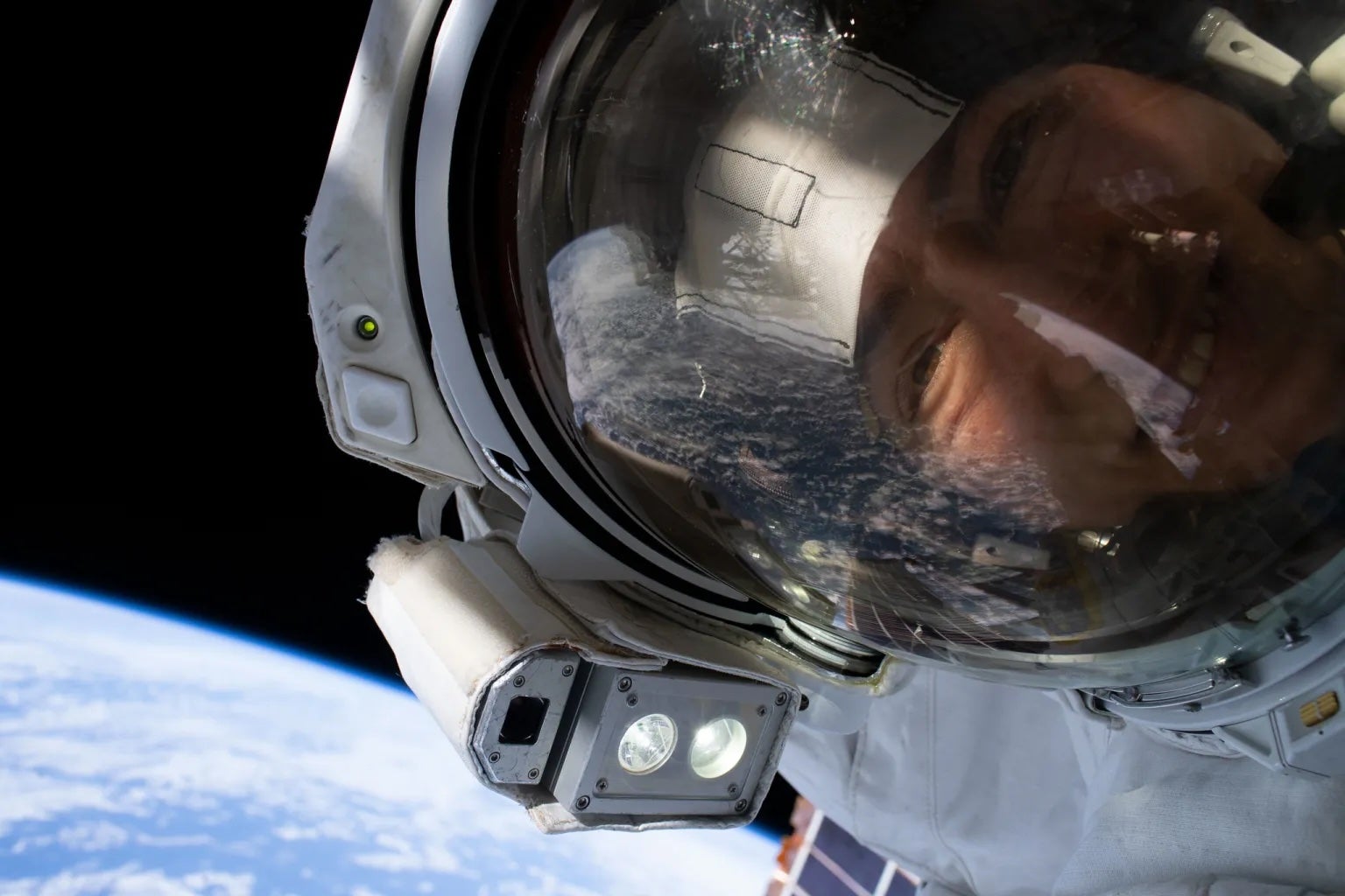 NASA astronaut Christina Koch takes a selfie with the Earth behind her while performing the first all-woman spacewalk in October 2019