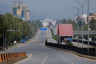 An empty road as security forces block passage ahead of peace talks