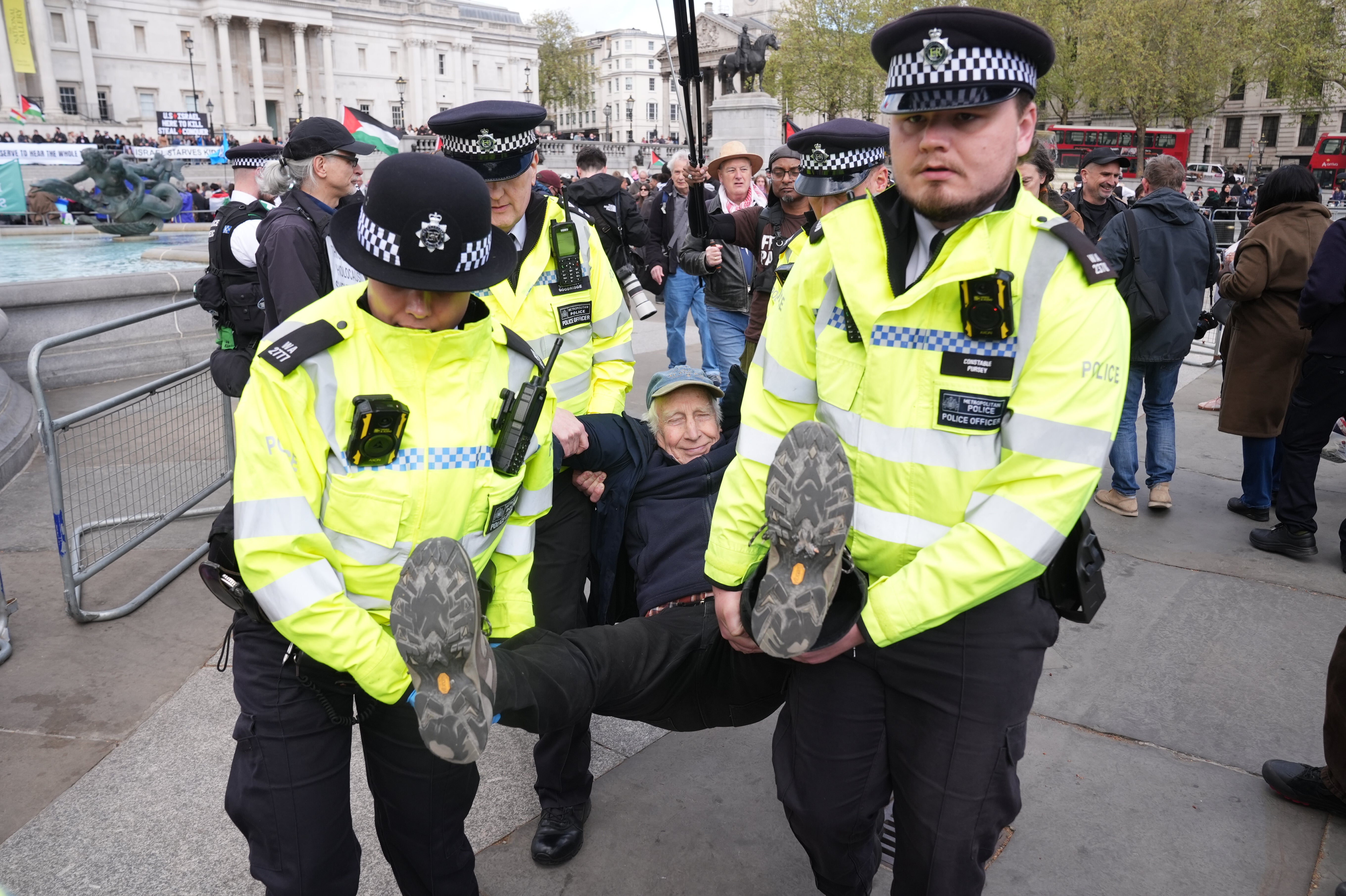 Police remove a protester at a demonstration against the ban on Palestine Action, in Trafalgar Square