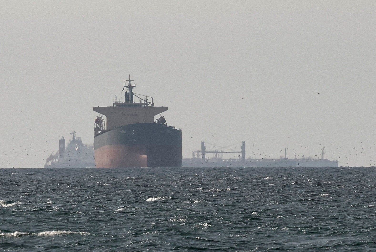 Cargo ships in the Gulf, near the Strait of Hormuz, as seen from northern Ras al-Khaimah, near the border with Oman's Musandam governance