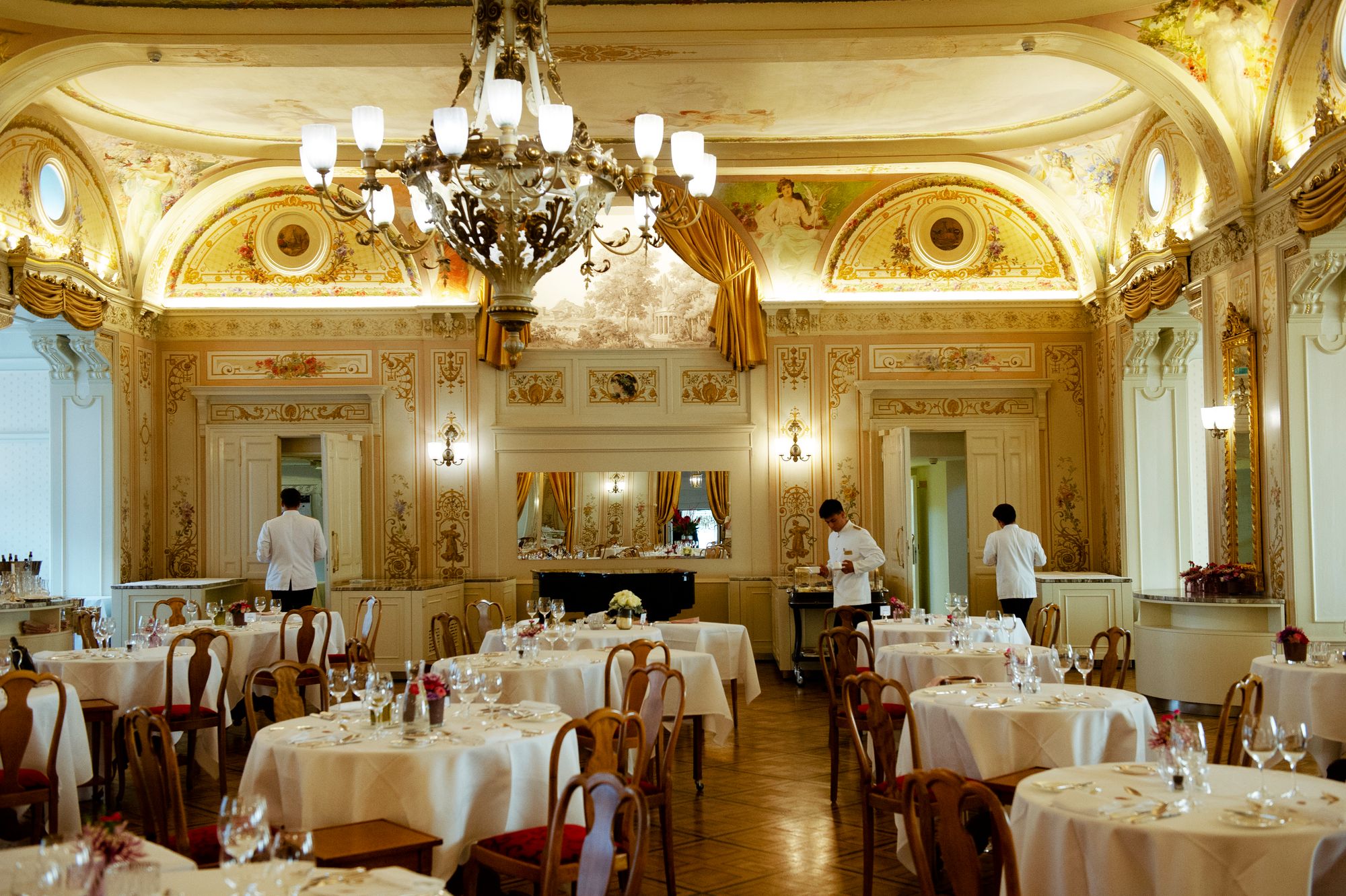 The fairytale main restaurant at Grand Hotel Kronenhof, where breakfast is served and, in the evening, a formal dinner service takes place