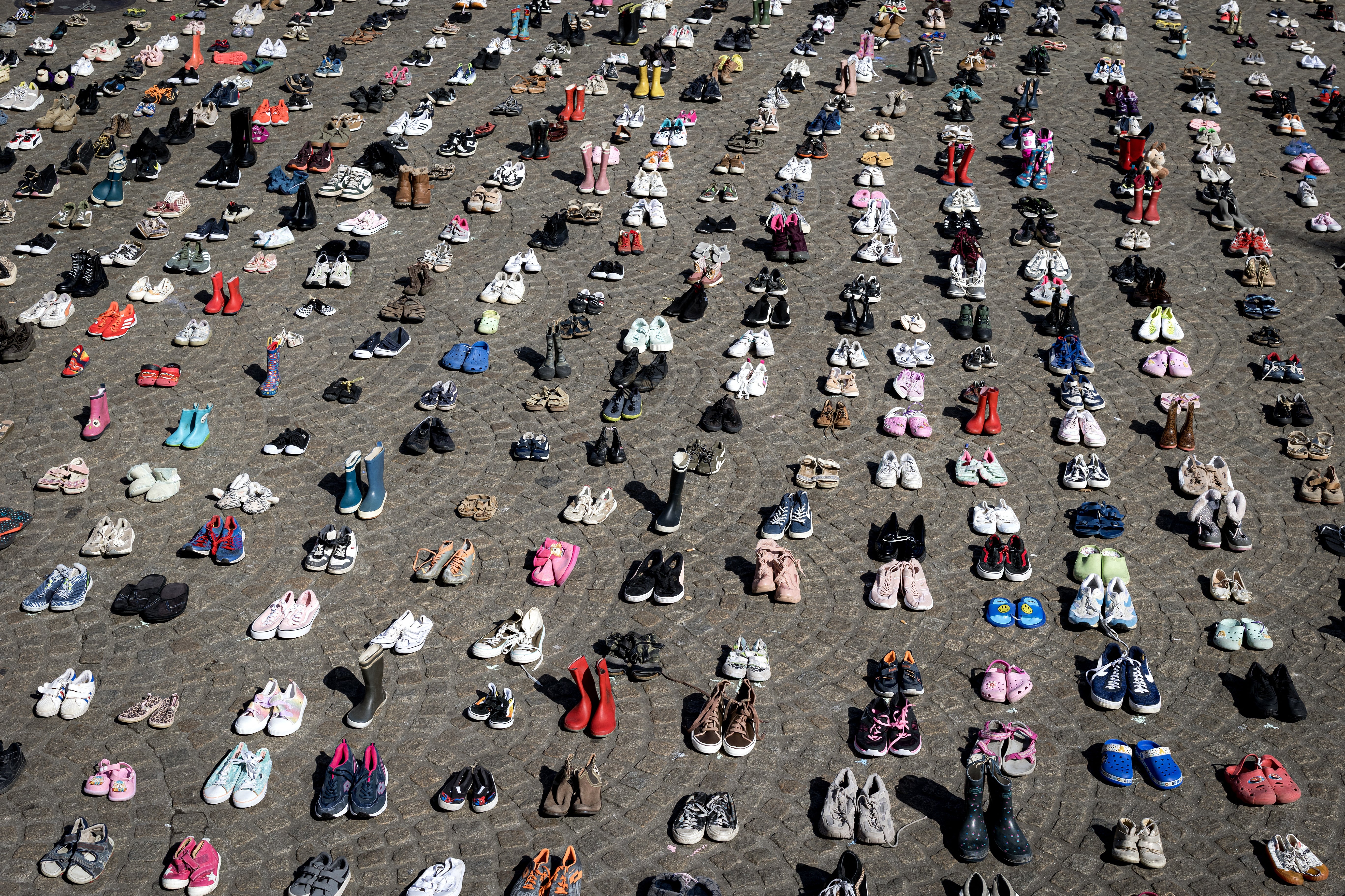 Children’s shoes in Amsterdam’s Dam Square during a memorial protest organised by Plant an Olive Tree group for child victims in Gaza