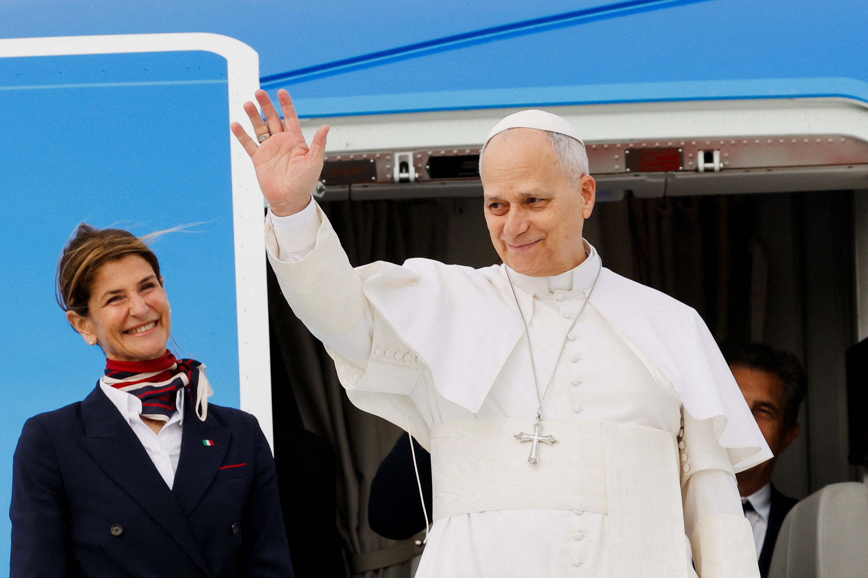 The Pope waves as he boards the papal plane ahead of his first journey to Algeria, Angola, Cameroon and Equatorial Guinea