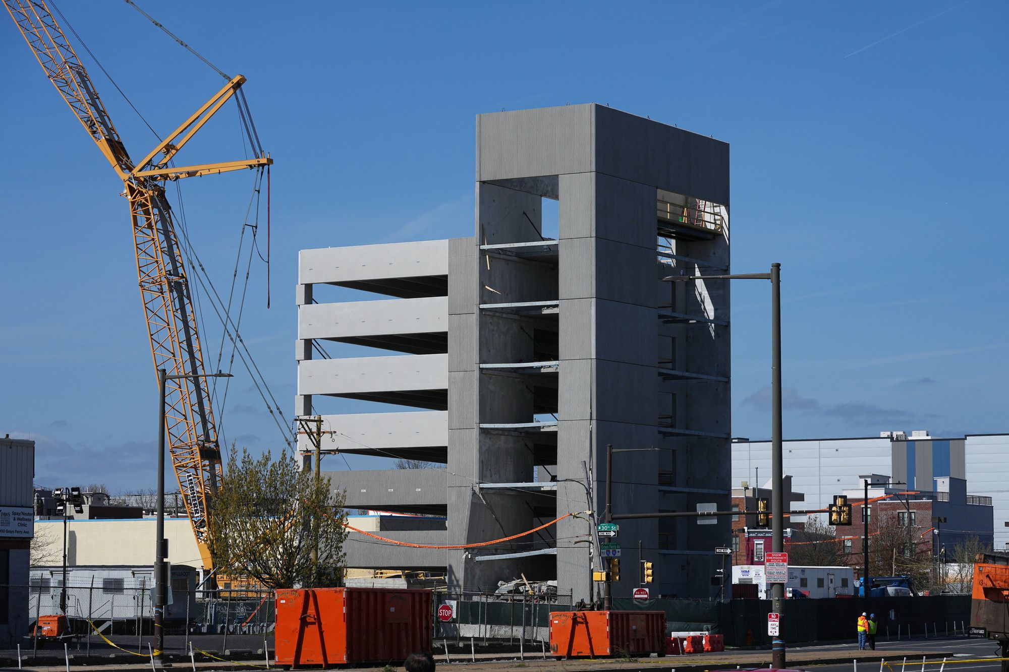 First responders inspect the partially collapsed parking garage in Philadelphia, Thursday, April 9, 2026