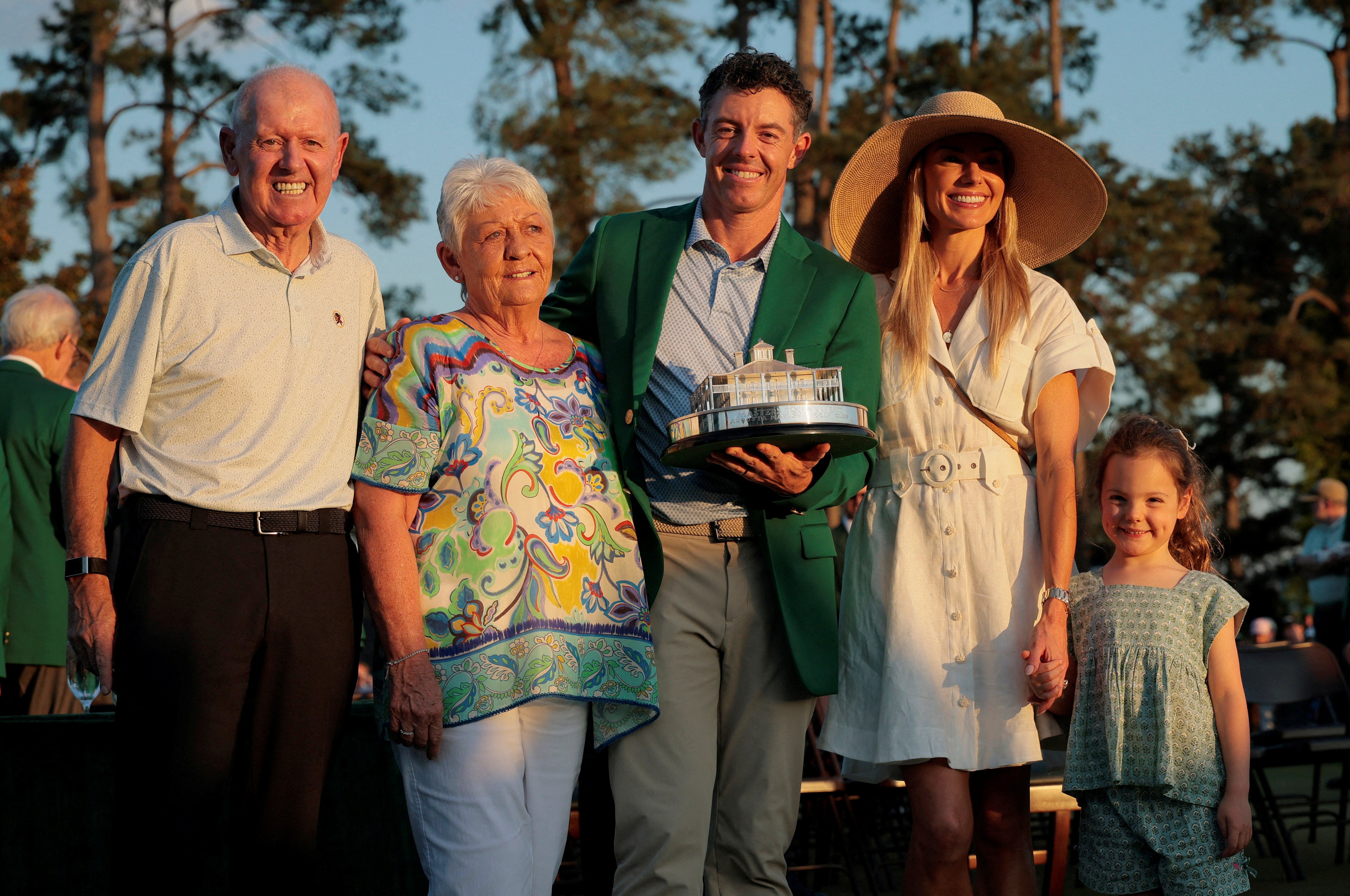 McIlroy with his family after winning a second Masters, including parents Rosie and Gerry McIlroy - who would not miss a second green jacket