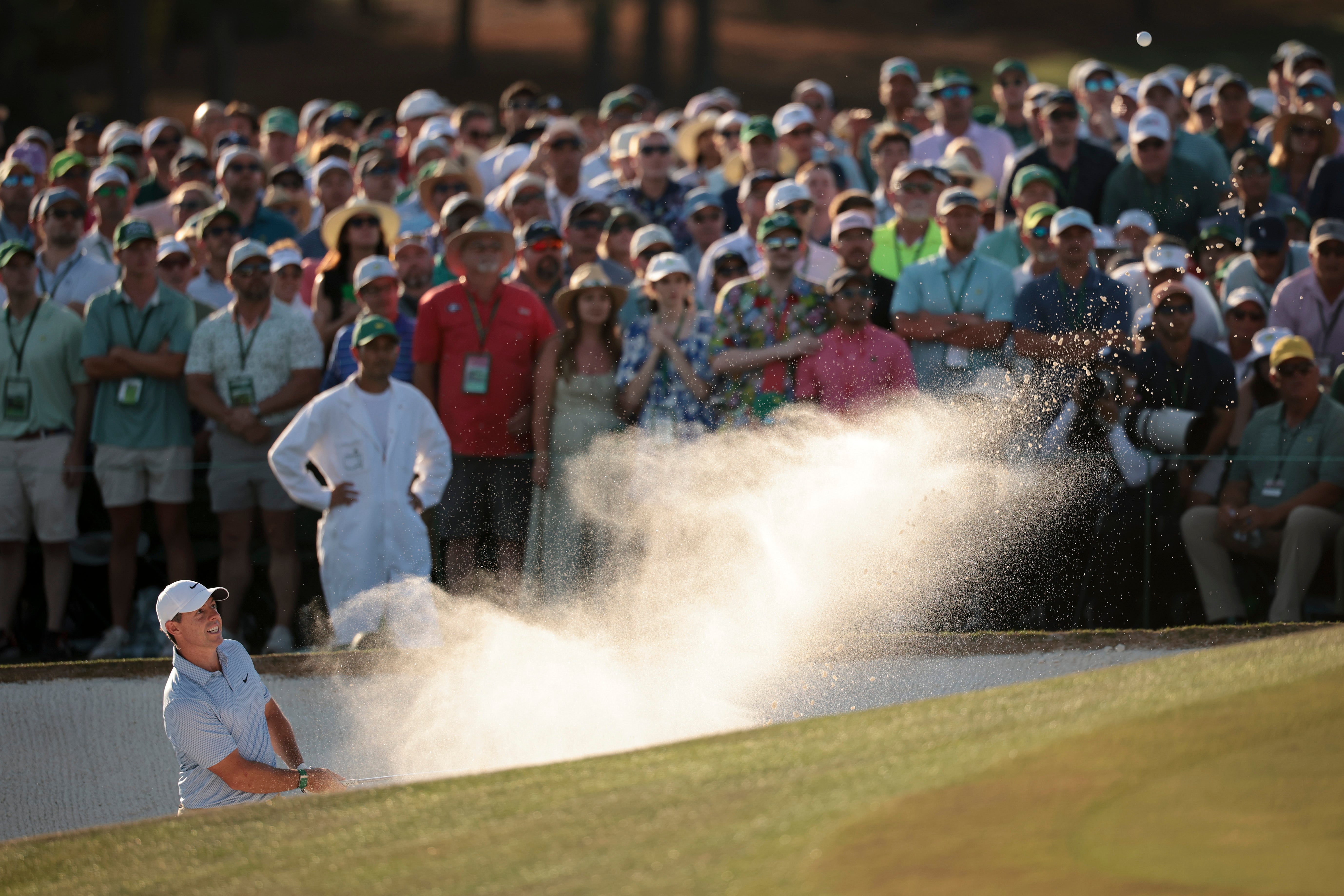 McIlroy was required to escape from the bunker on the 18th in order to avoid a double bogey