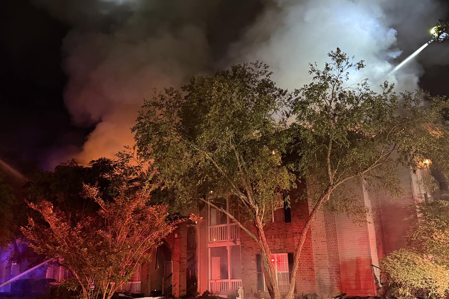 Part of the Georgetown Oaks apartment complex in Savannah, Georgia, ablaze during the small hours of Sunday April 12, 2026