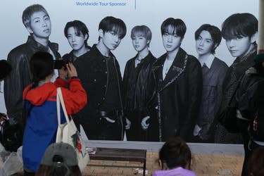 <p>A BTS fan takes a photo outside the venue for the band’s concert in Goyang, South Korea</p>