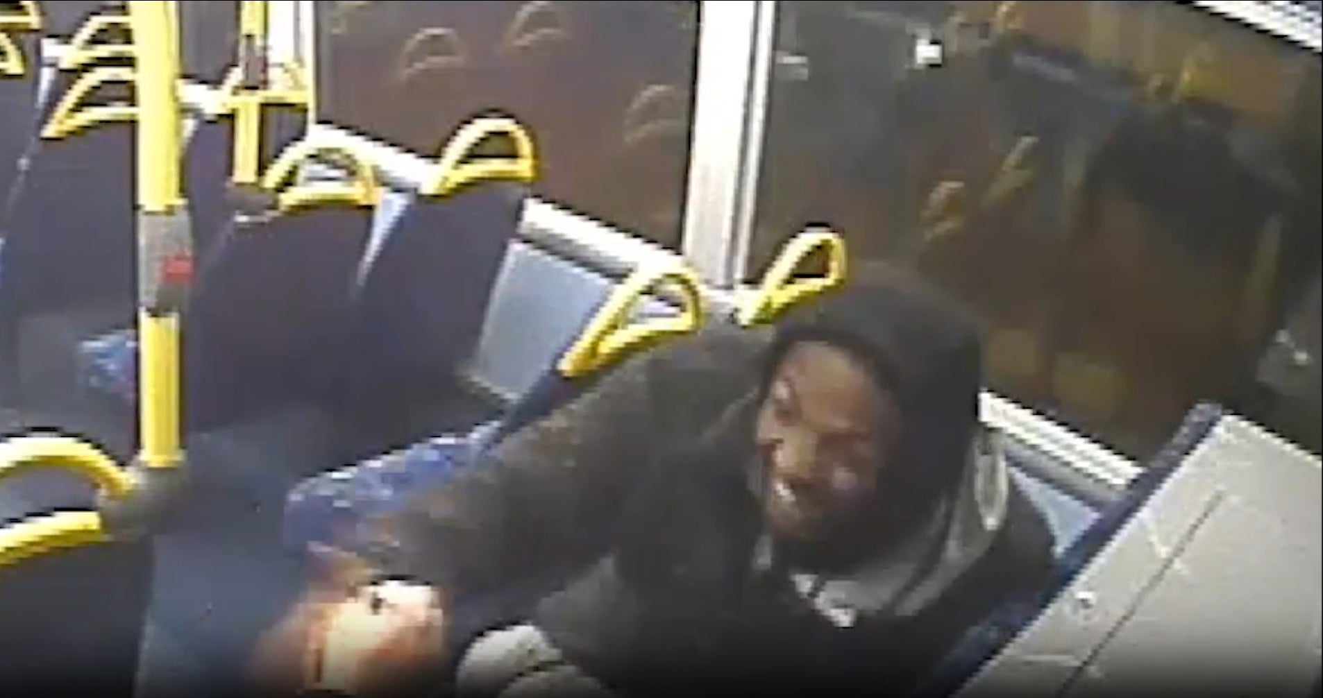 Dino Donaldson smiling on a bus after the killing