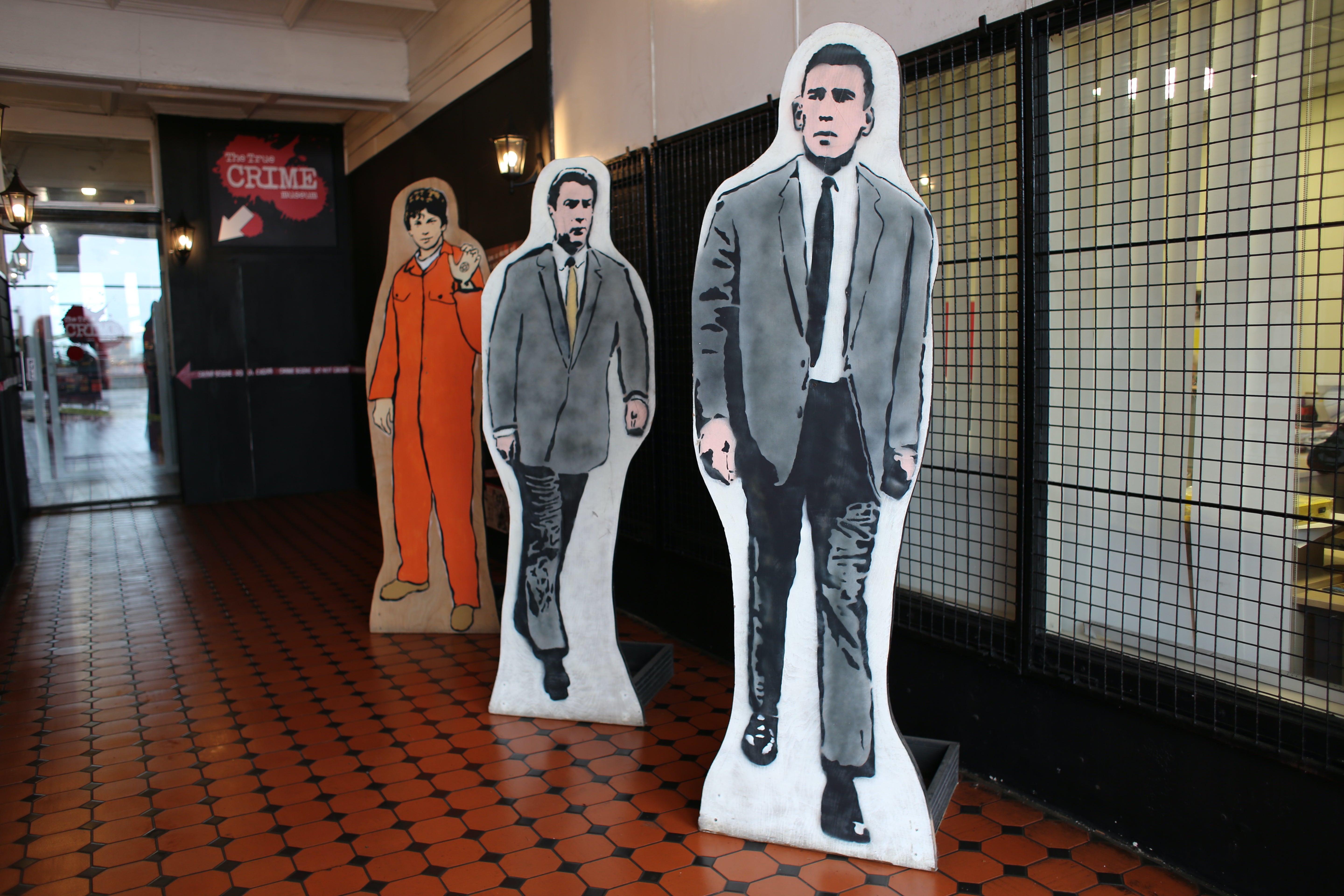 The intruder allegedly 'punched and kicked' the cardboard cutouts of the Kray twins at the entrance to the museum