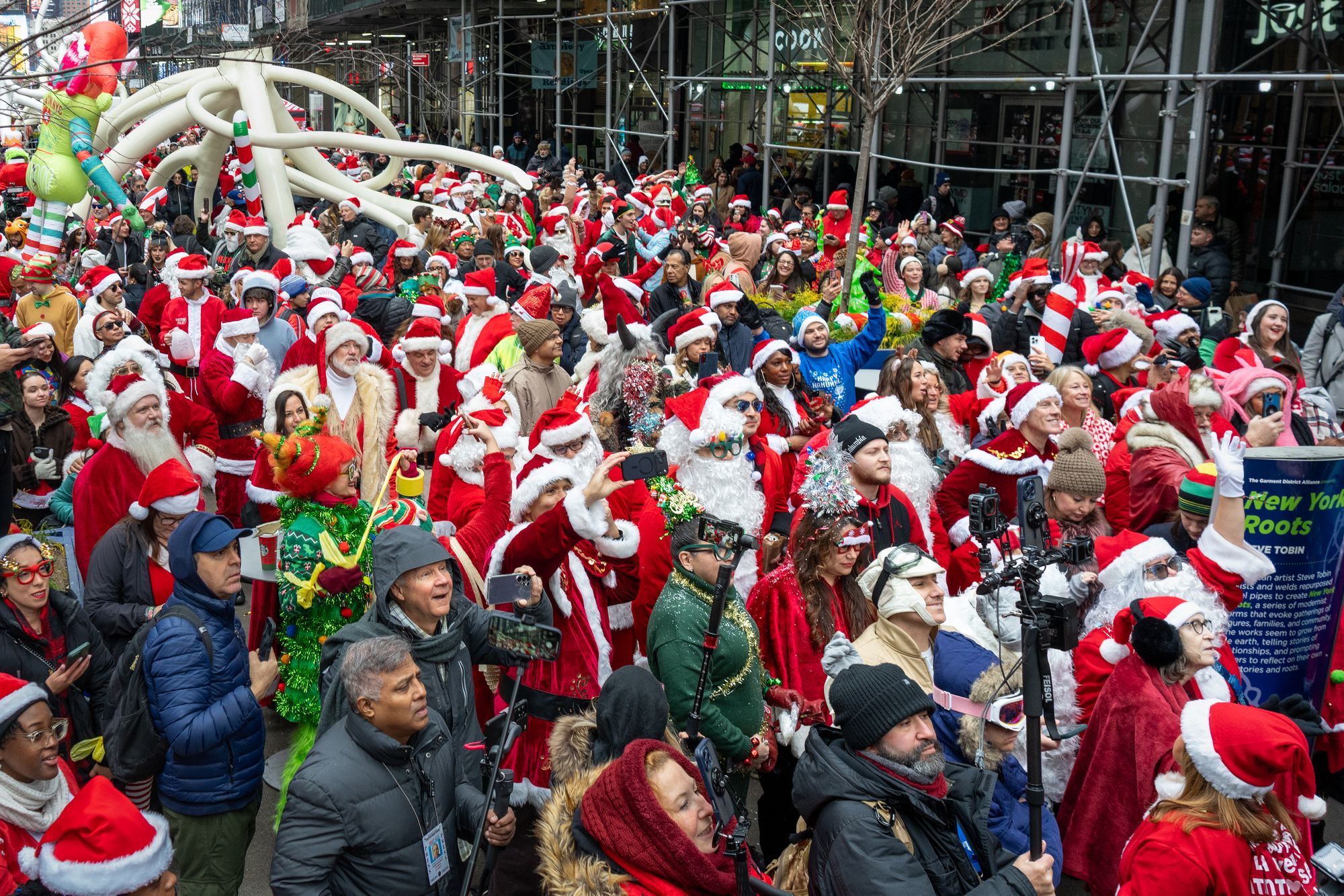 Revelers gather during the SantaCon bar crawl on December 13, 2025 in New York City