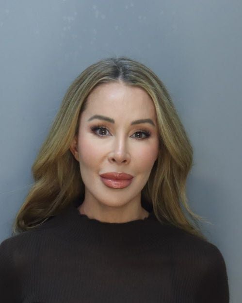 'Real Housewives of Miami' star Lisa Hochstein has turned herself in after allegedly spying on her ex-husband's communications
