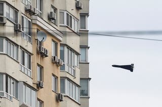 A Russian Geran 2 kamikaze drone seen on its trajectory to attack a Ukrainian apartment building