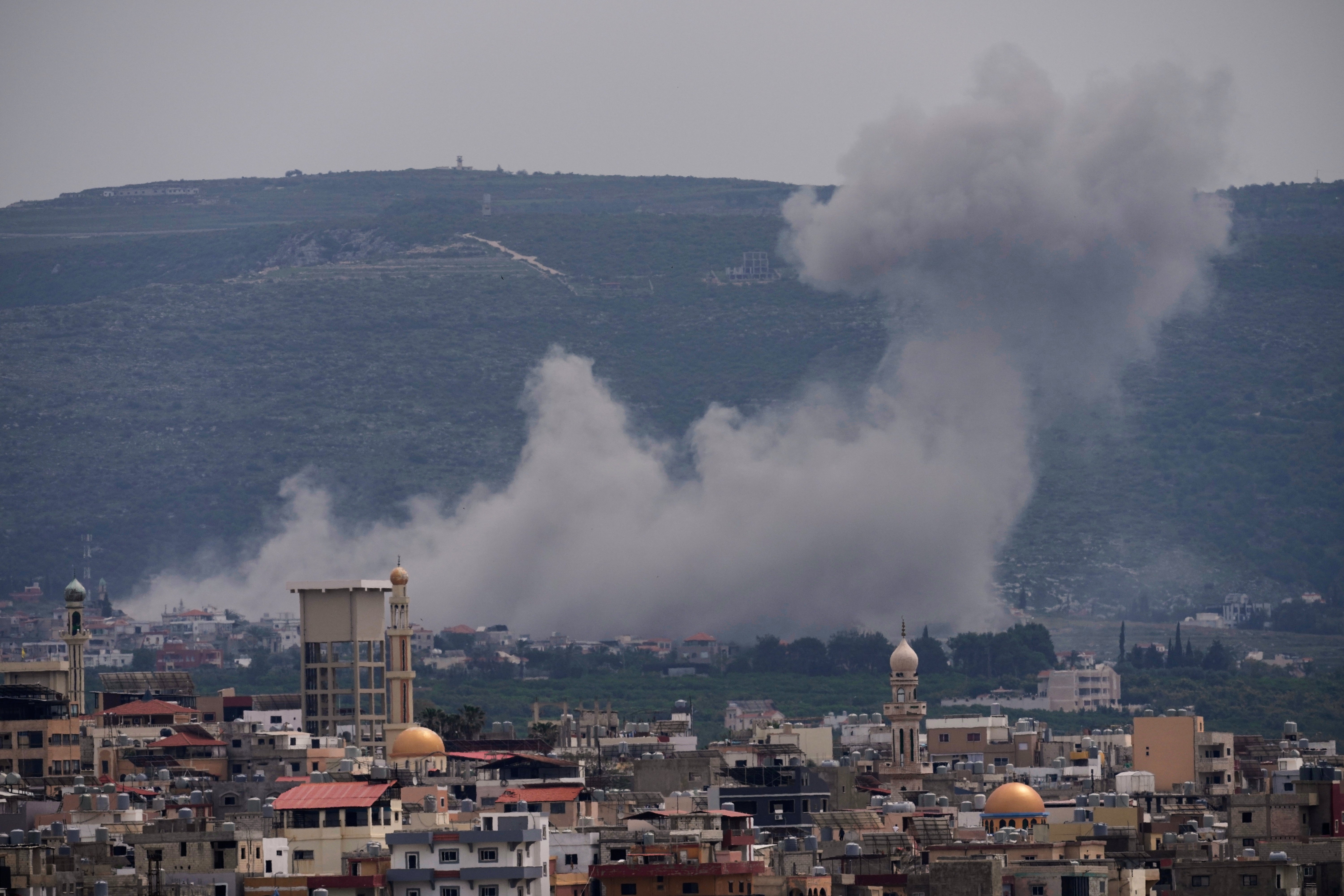 Smoke rises following an Israeli airstrike on the village of Qlaileh, as seen from the southern port city of Tyre