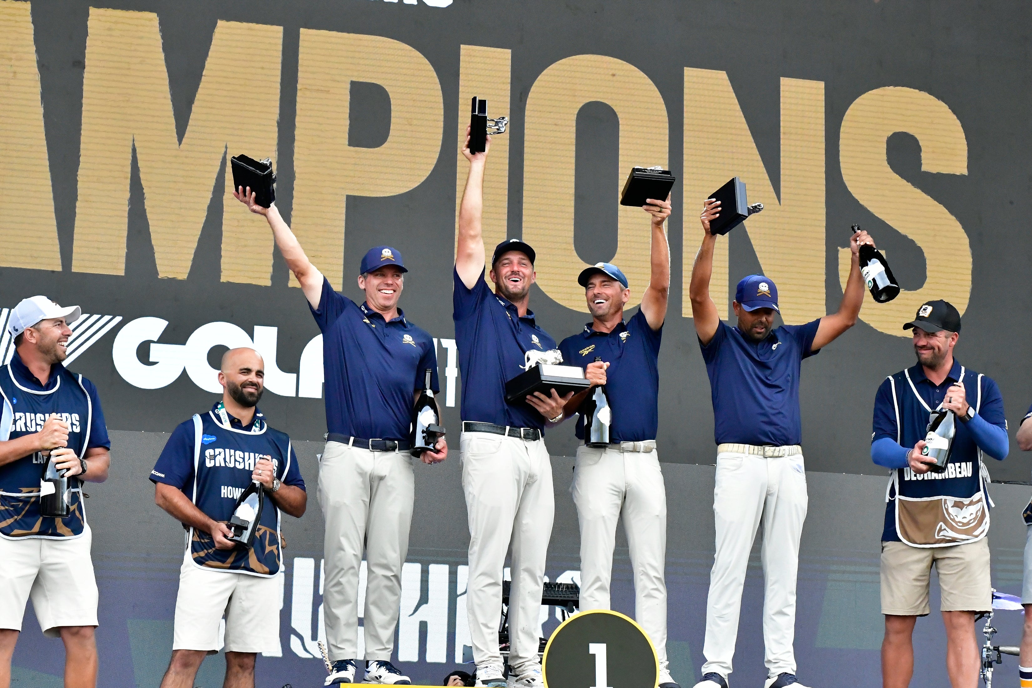 Bryson DeChembeau, centre, and his team celebrate their win at Midrand, South Africa