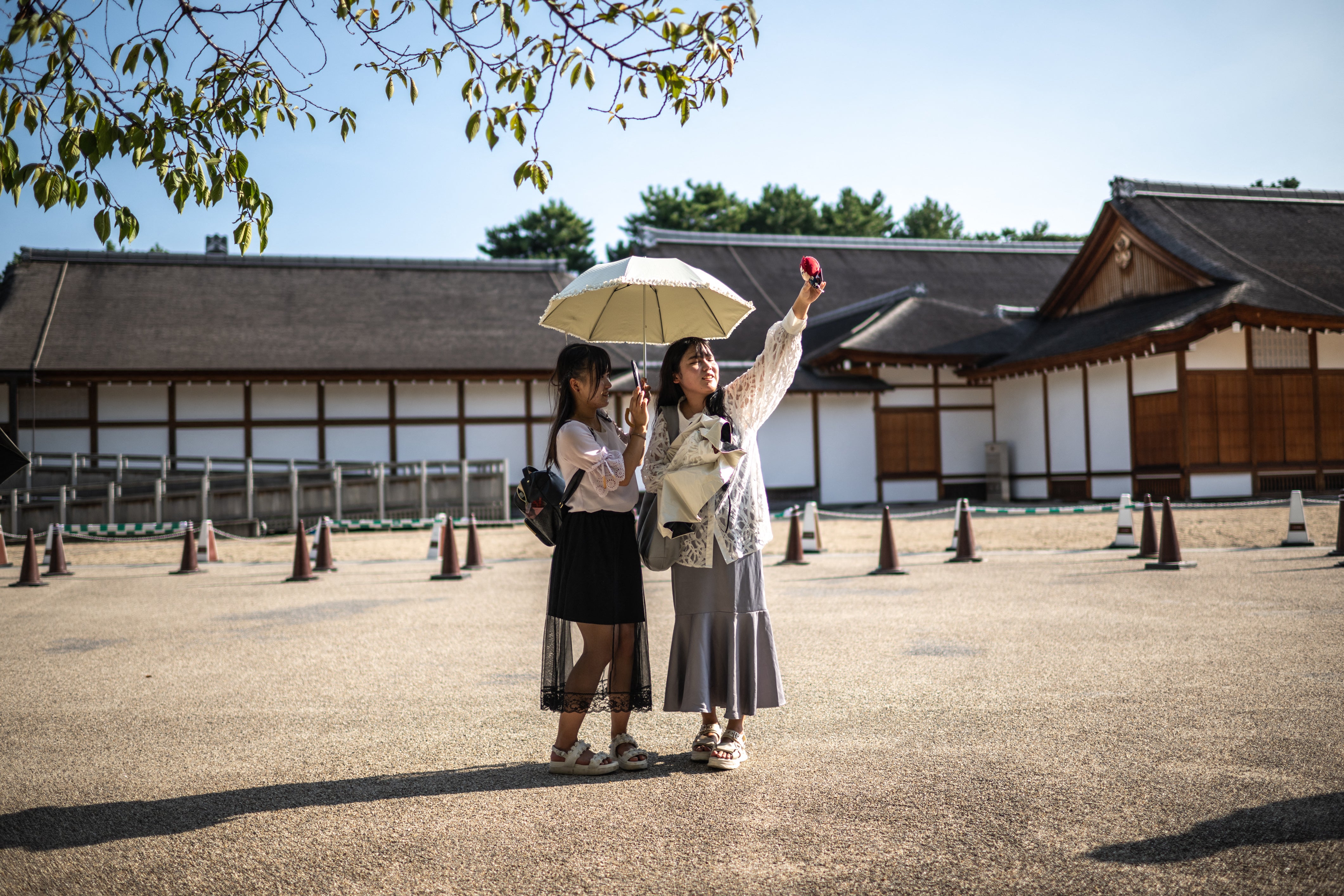 People visit the Nagoya Castle on a hot day amid a heatwave in Japan