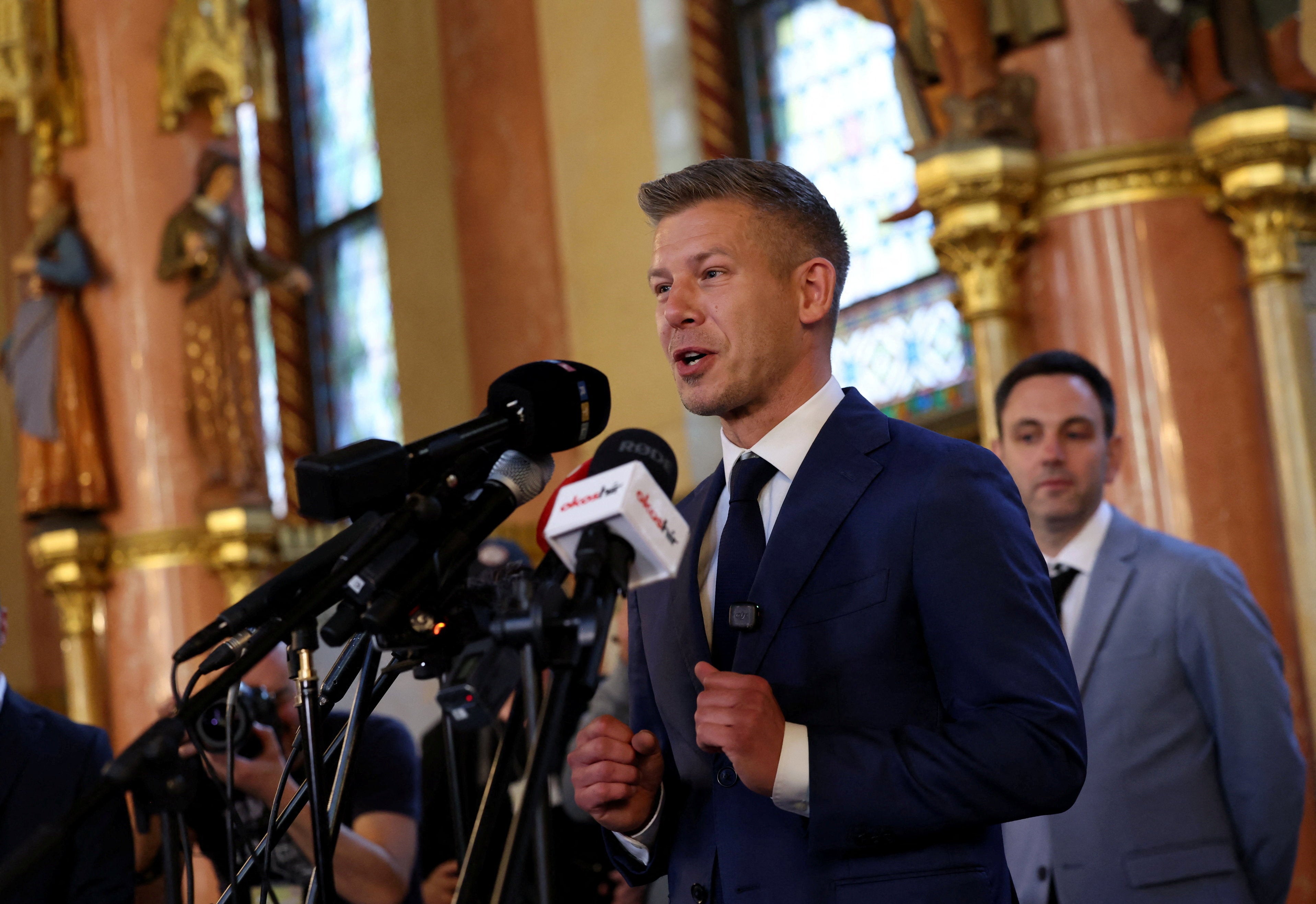 Hungary's election winner Peter Magyar talks to the media after talks between parties on preparations for the first session of the Parliament in Budapest