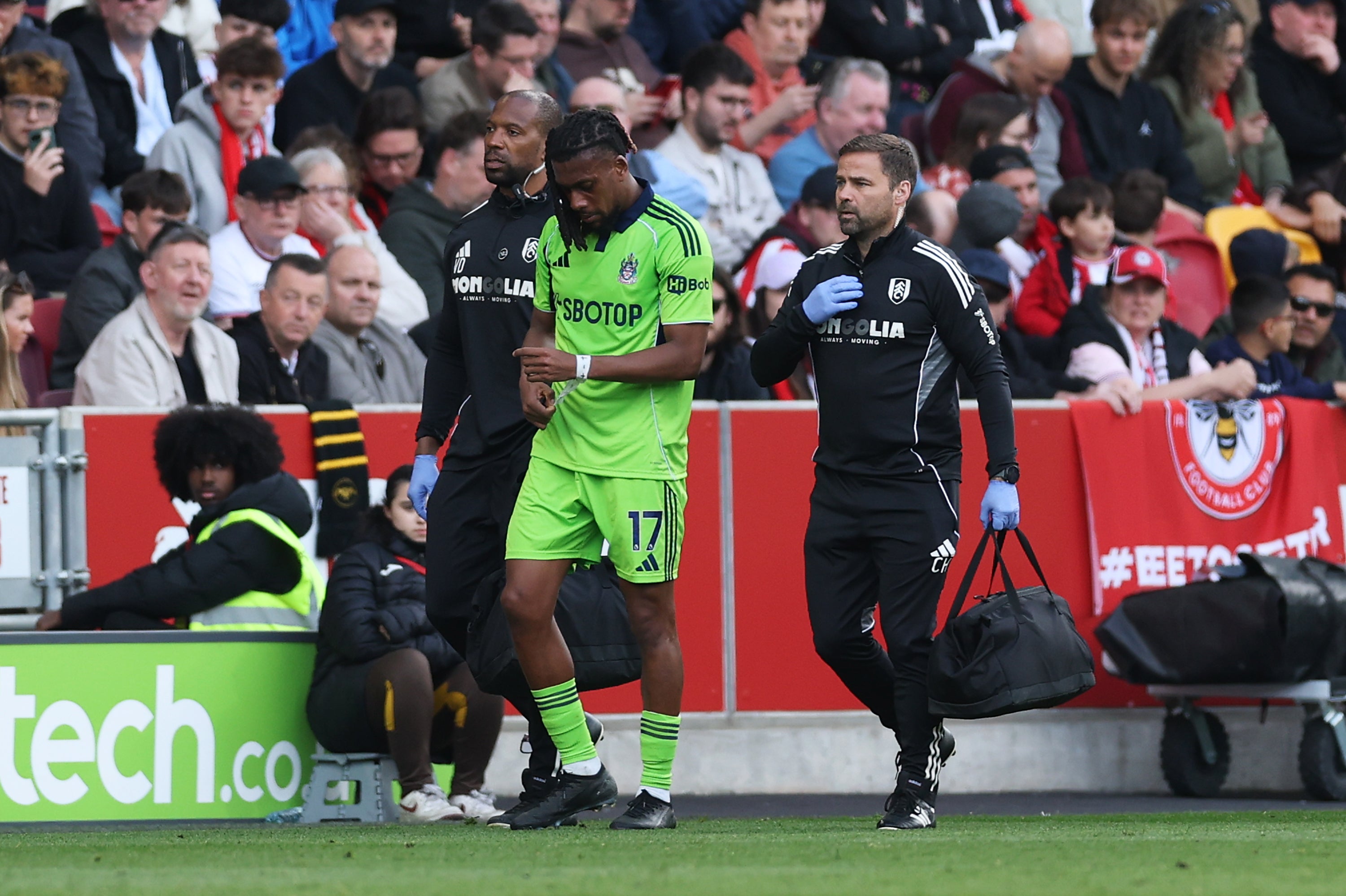 Alex Iwobi limped off injured before the break