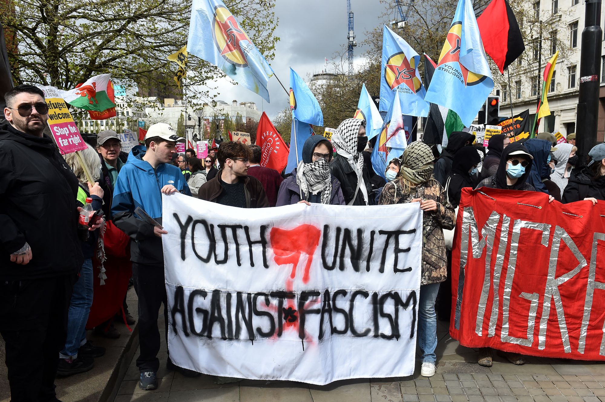 Counter protests hold signs and wave flags