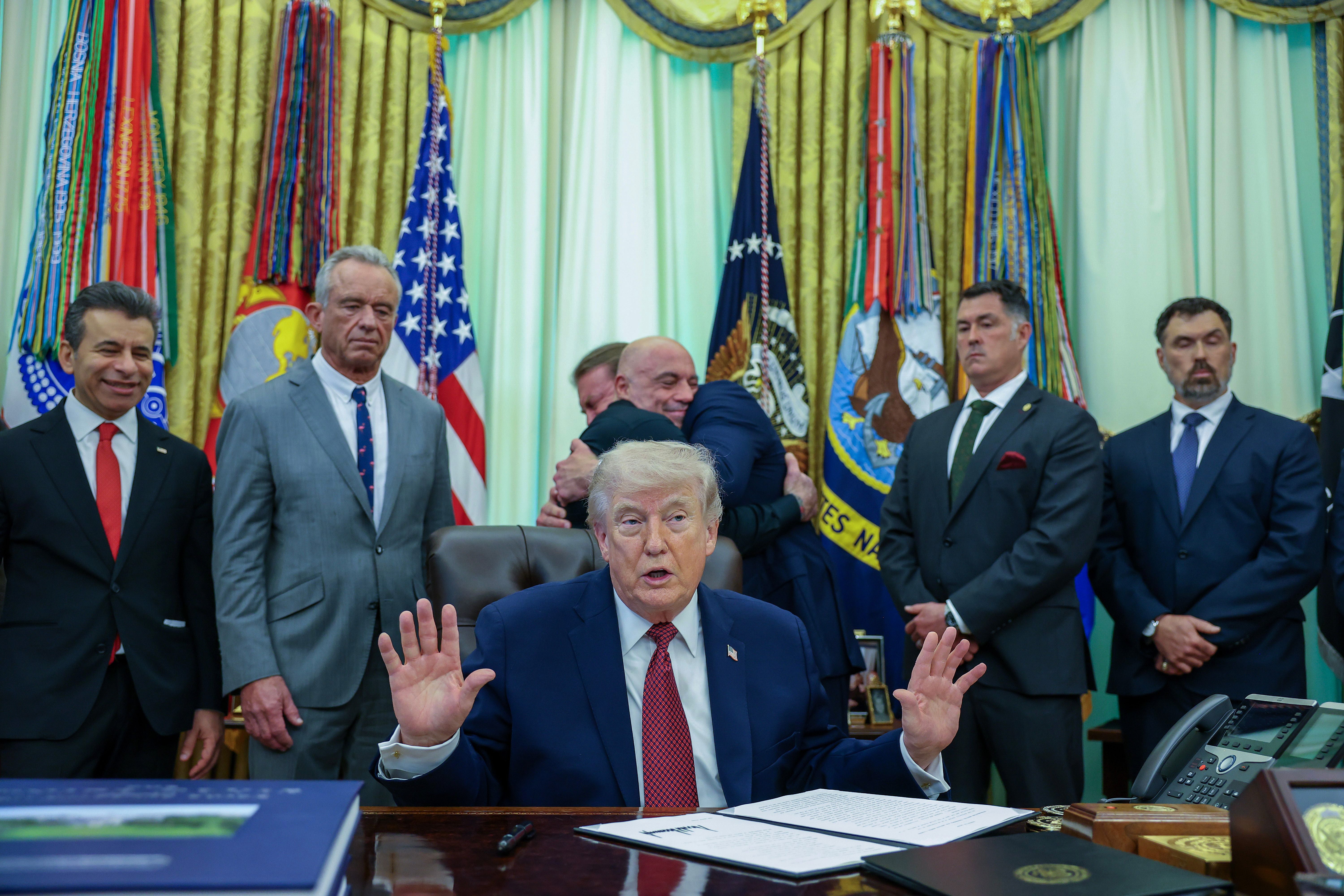 President Donald Trump speaks in the Oval Office as he signs an Executive Order on 18 April