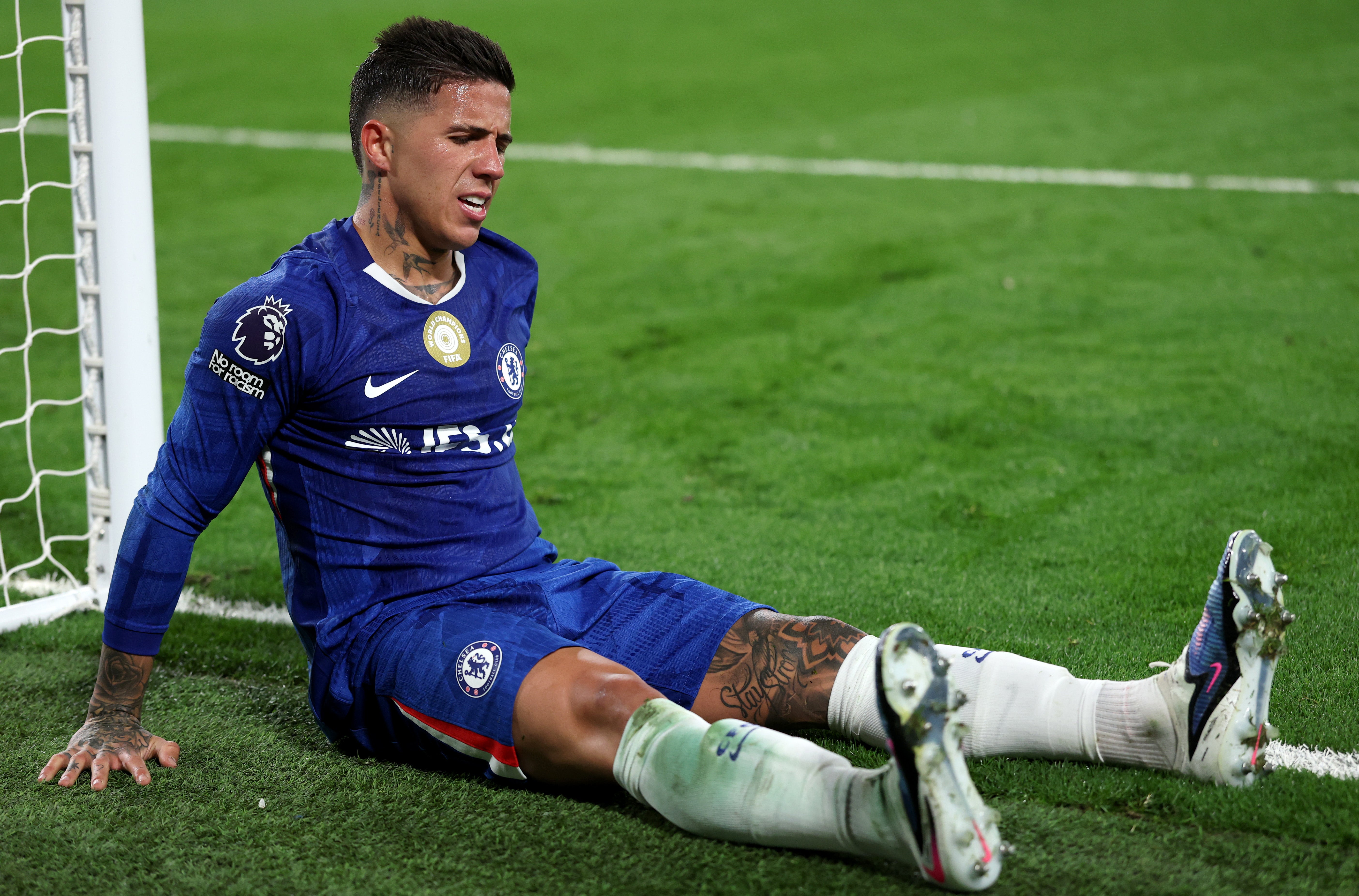 Enzo Fernandez of Chelsea reacts after a calf problem