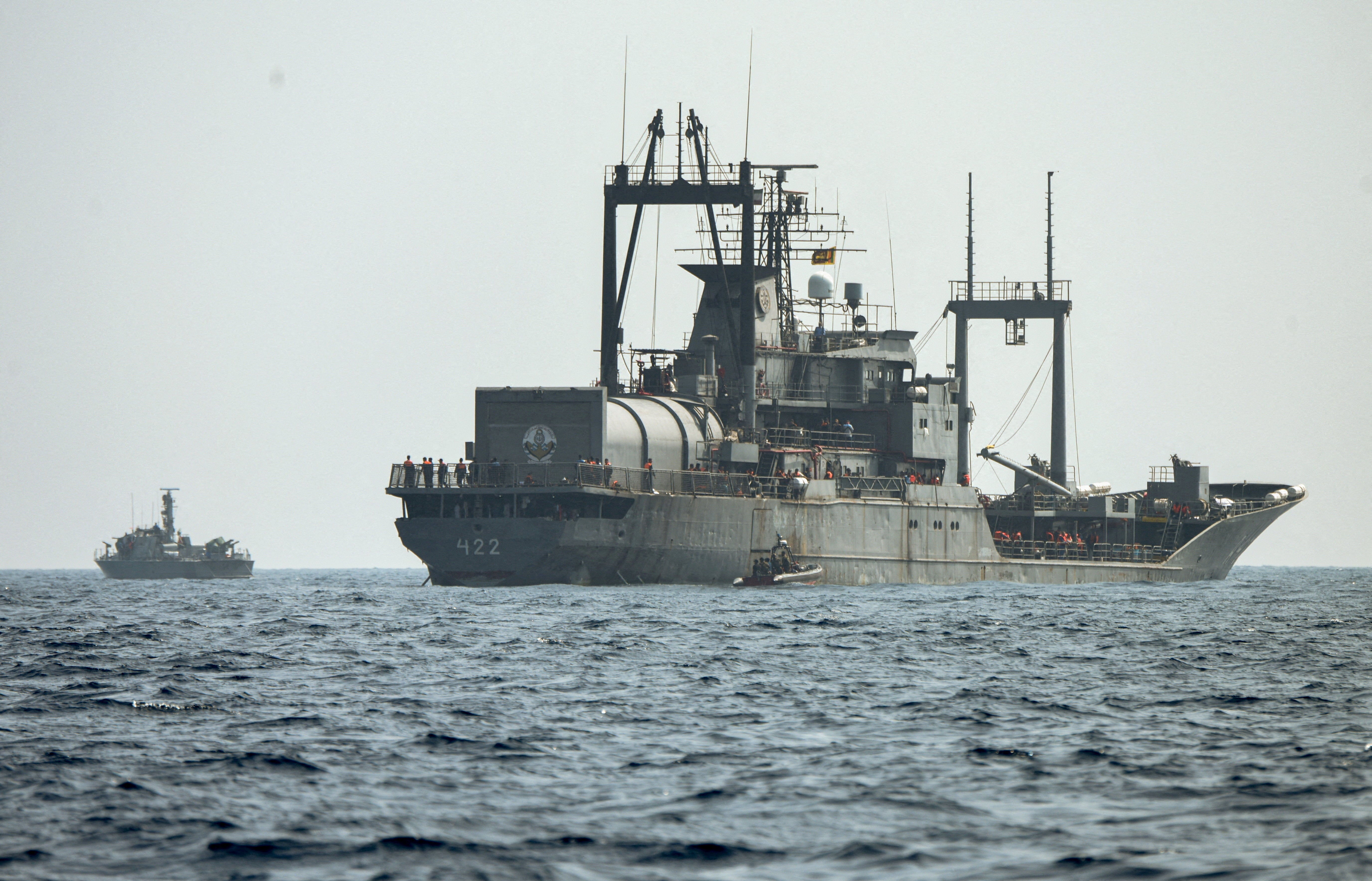 A Sri Lanka Navy vessel approaches an Iranian Navy vessel IRIS Bushehr during a rescue operation, a day after the crew of a distressed Iranian military ship, IRIS Dena, were assisted in waters south of Sri Lanka, off the coast of Colombo, Sri Lanka, 5 March 2026