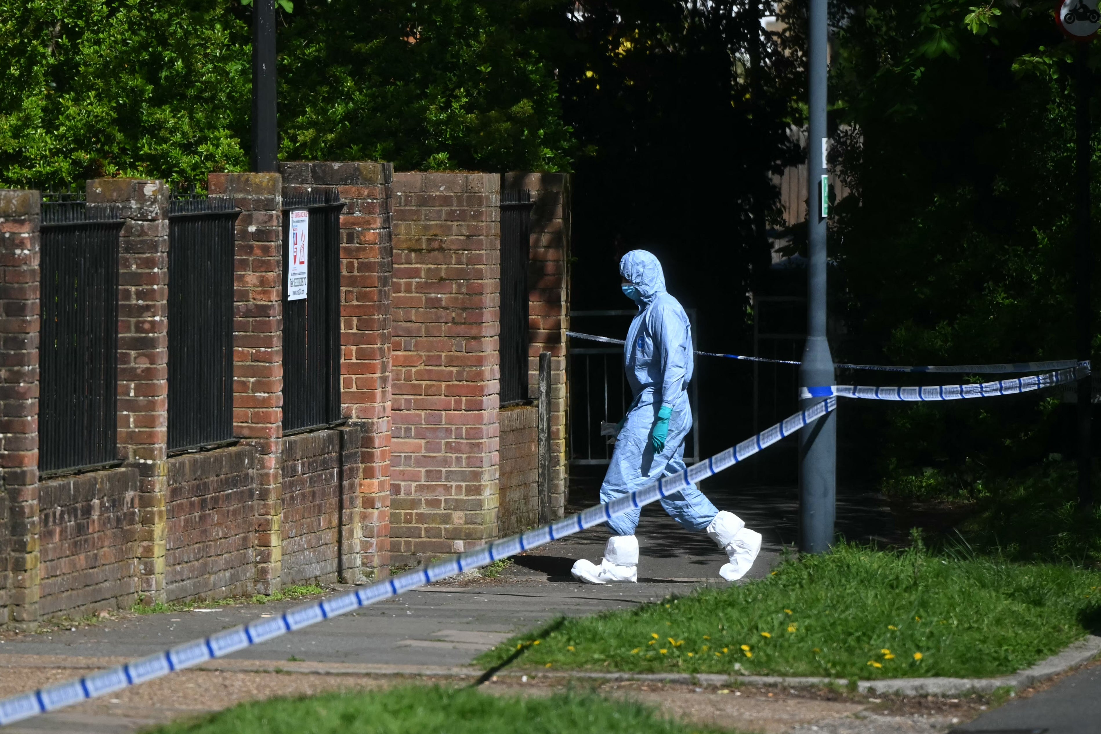 A police forensic officer works inside a cordon set up near Kenton United Synagogue in Harrow, northwest London