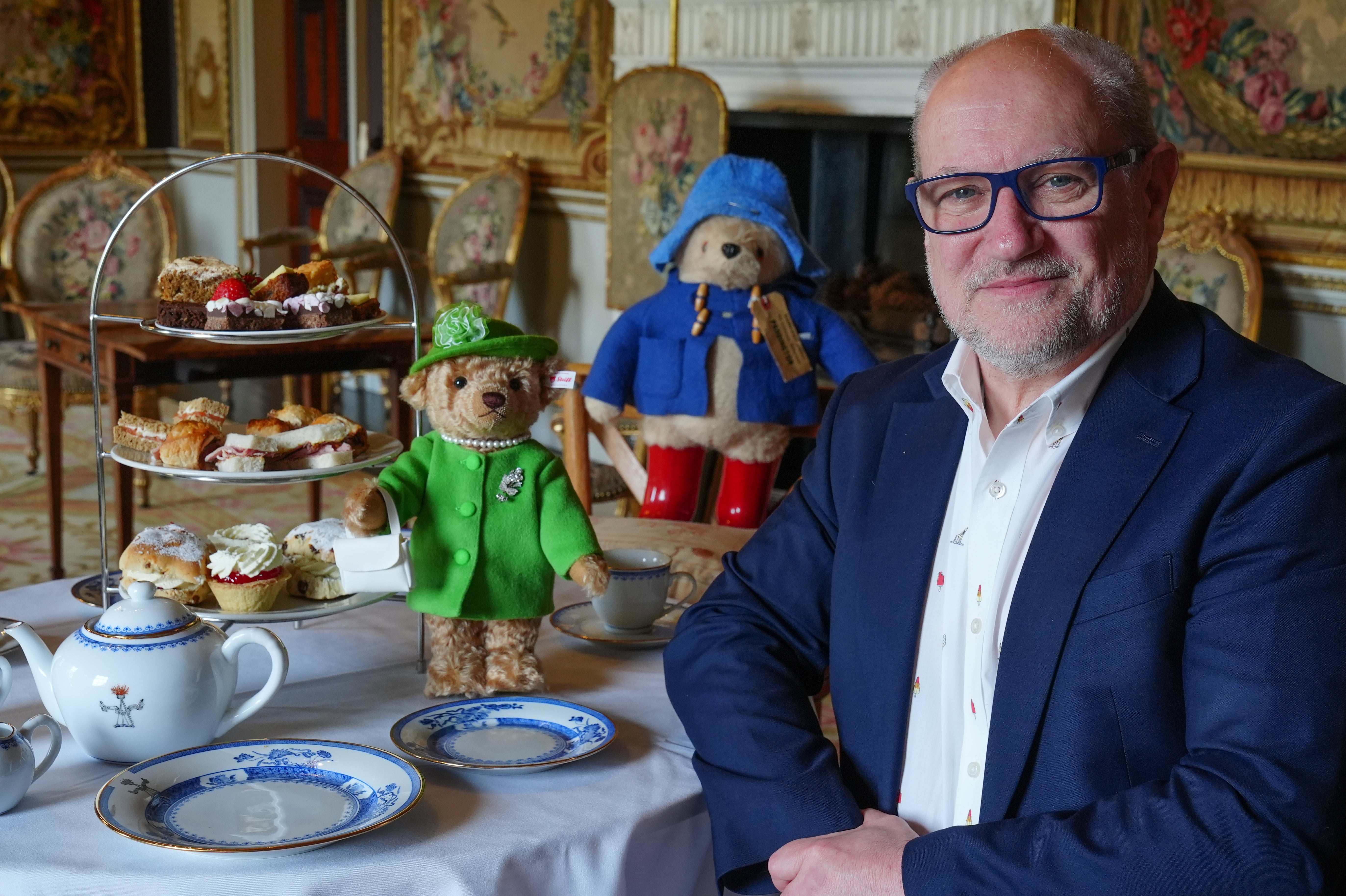 Stieff's Ian Munro with a recreation of the tea party shared by Queen Elizabeth II and Paddington Bear
