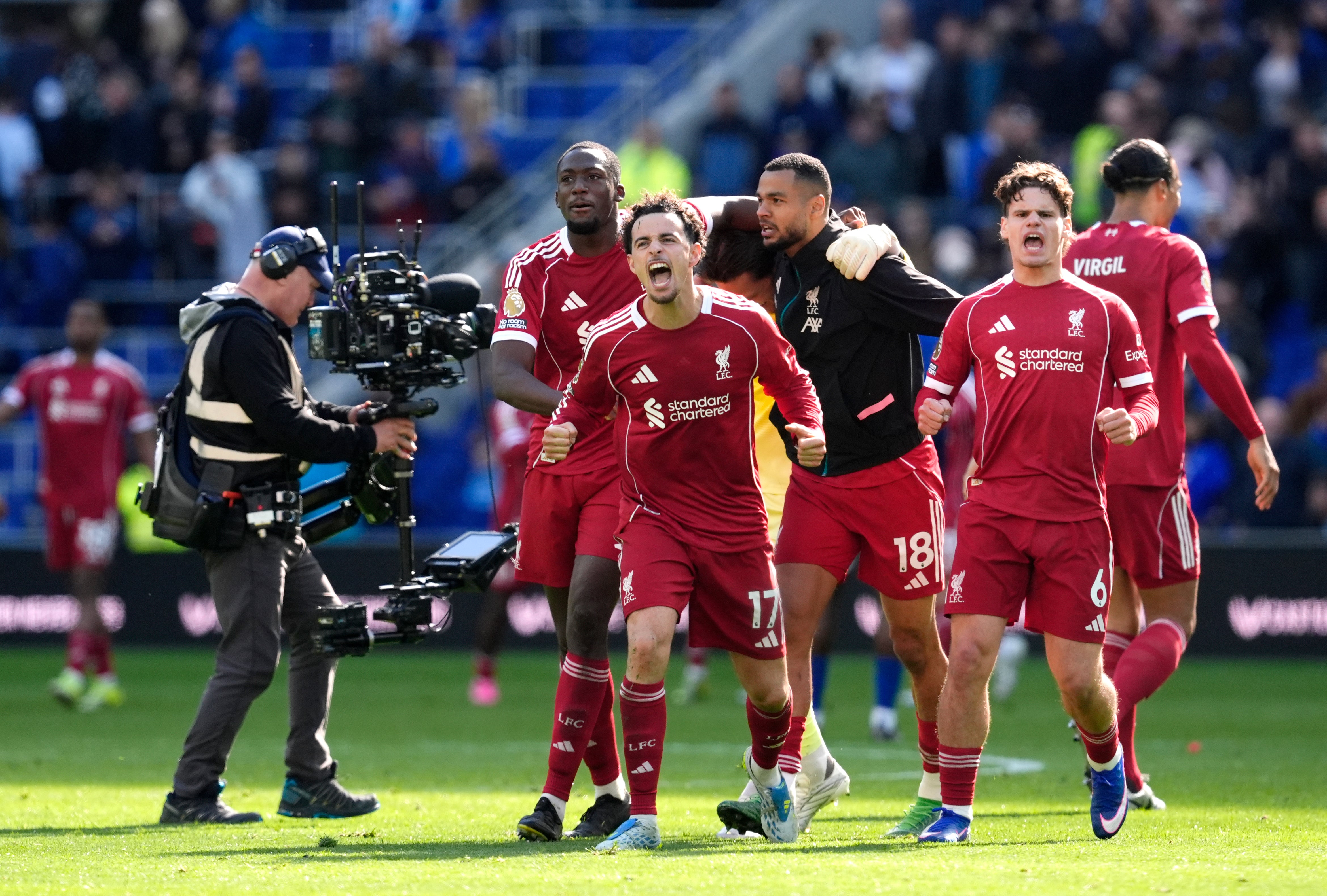 Liverpool celebrate victory at everton