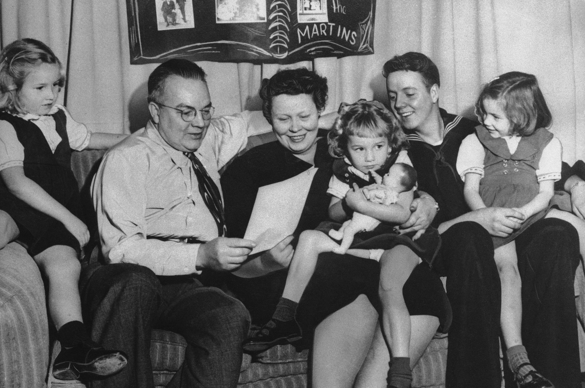This Christmas photo provided by the Ken Martin family shows, from left, Barbara, Ken, Barbara, Sue, Donald and Virginia in December 1952 in Portland, Oregon.