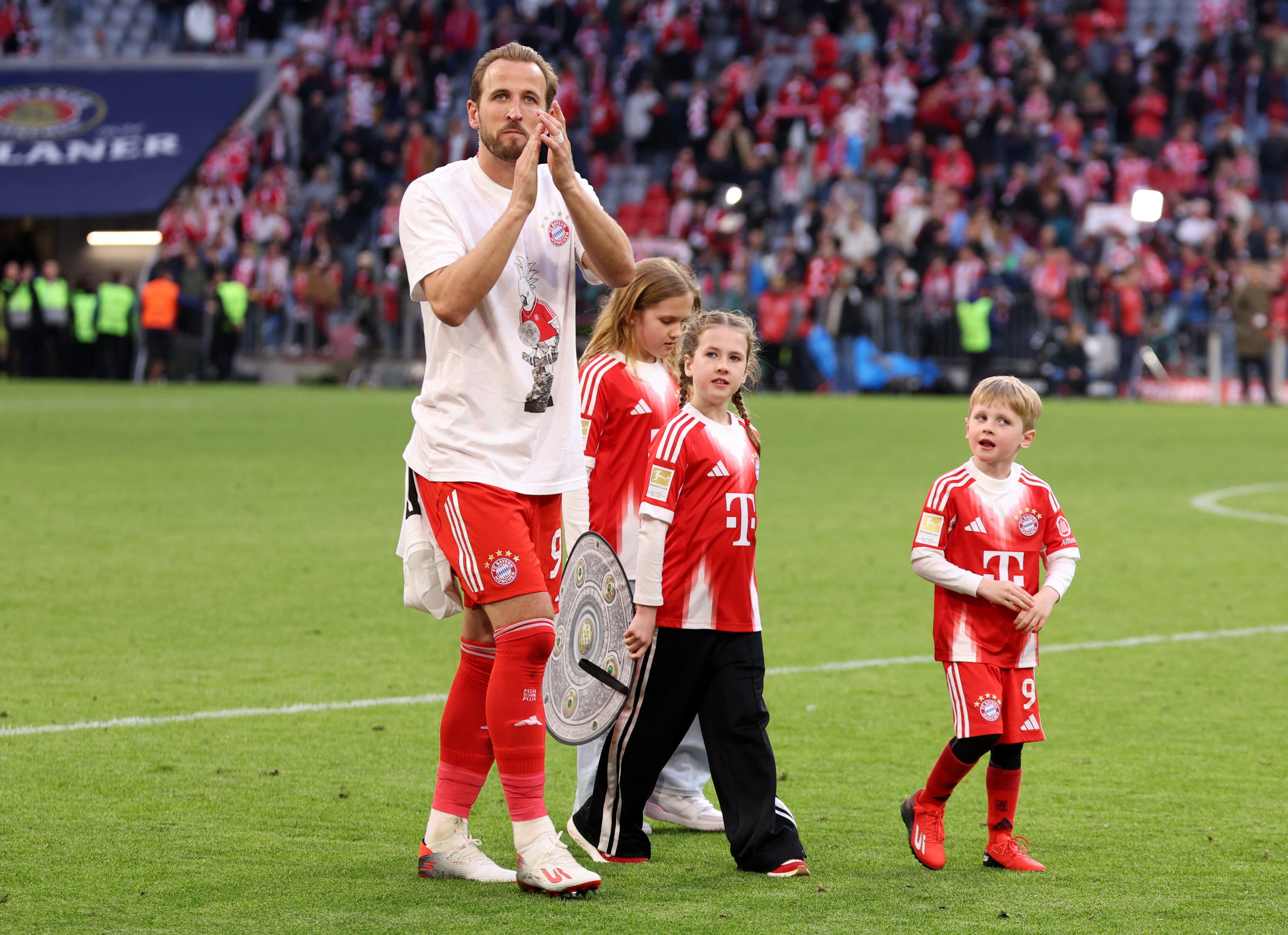 Harry Kane celebrated the title on the pitch with his family