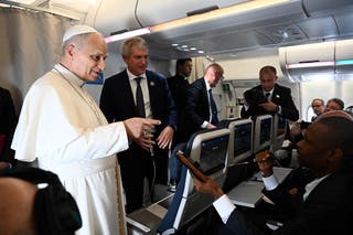 Pope Leo XIV speaks to journalists aboard a flight on his way to Luanda, Angola, 18 April 2026