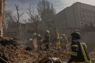 Ukrainian rescuers work at the site of heavily damaged buildings following a Russian air attack in Dnipro, on 16 April 2026, amid the Russian invasion of Ukraine