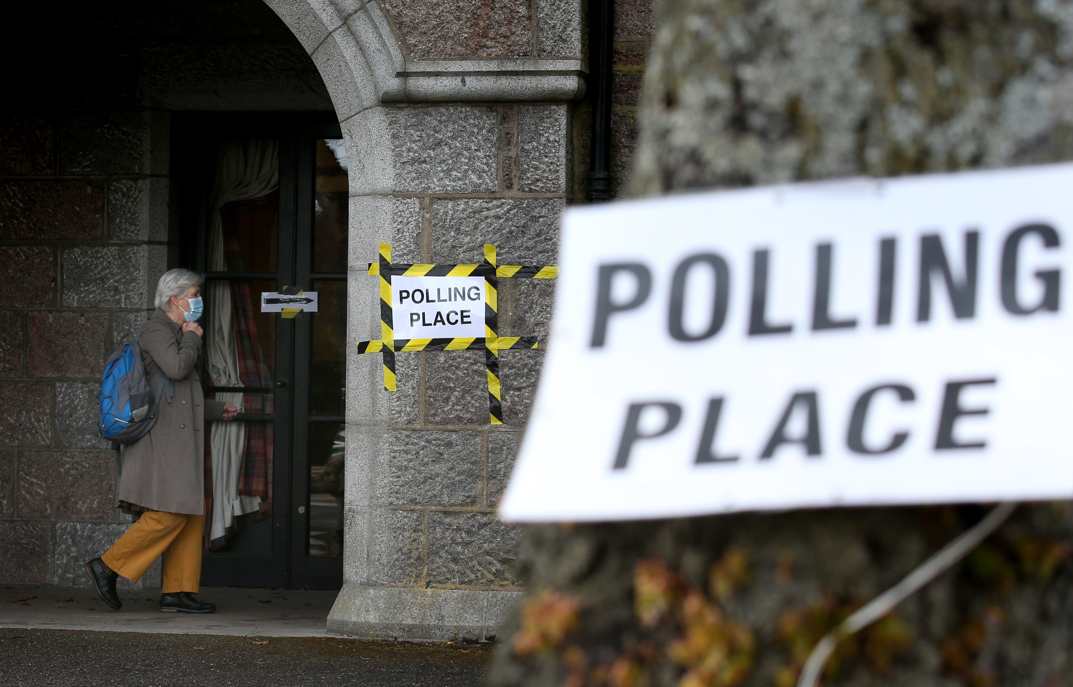 Voters arrive at the War Memorial building in Aboyne, Aberdeenshire which is being used as polling station (Andrew Millian/PA)