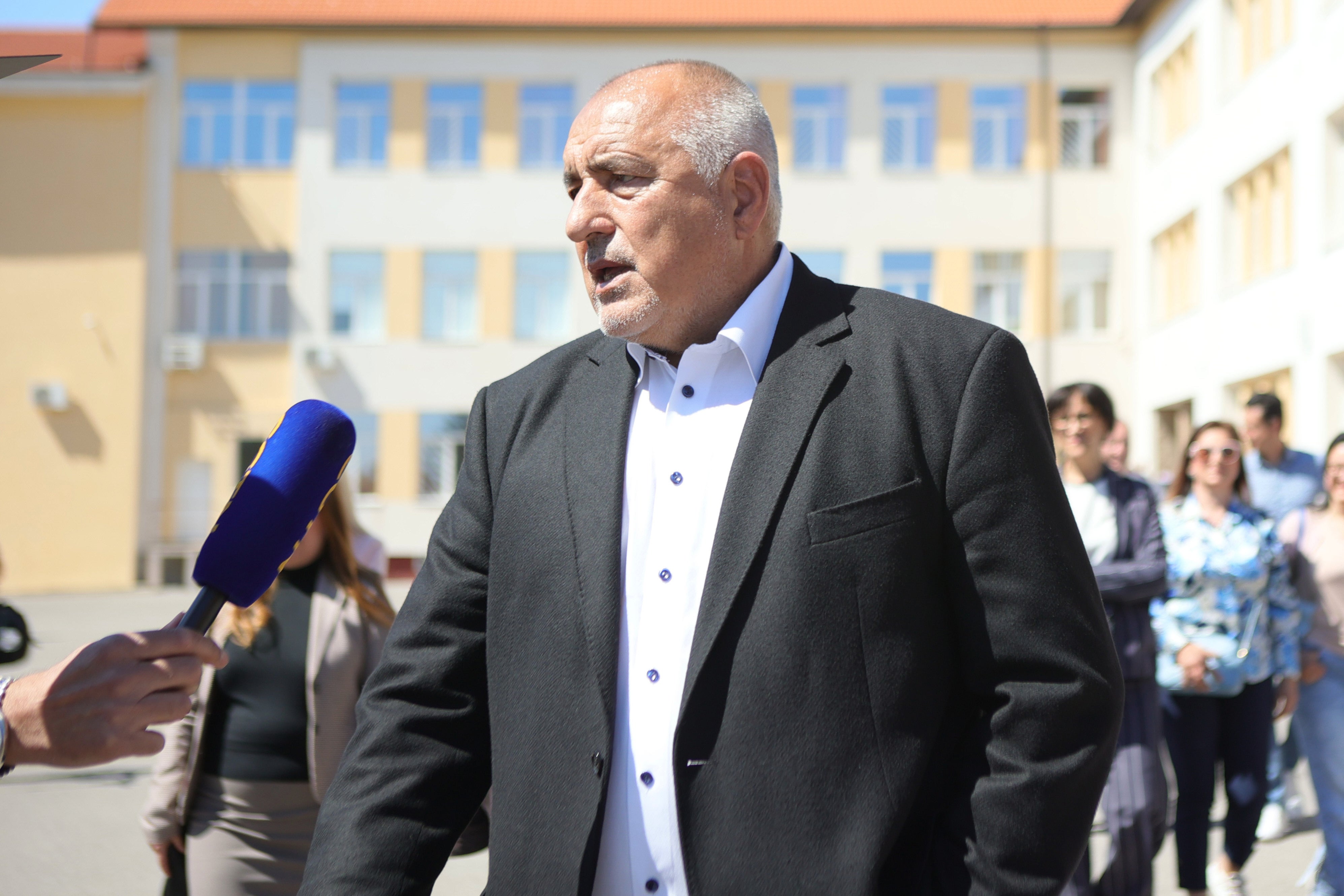 Former Prime Minister Boyko Borissov speaks to journalists after casting his vote in a polling station in Bankya, on Sunday