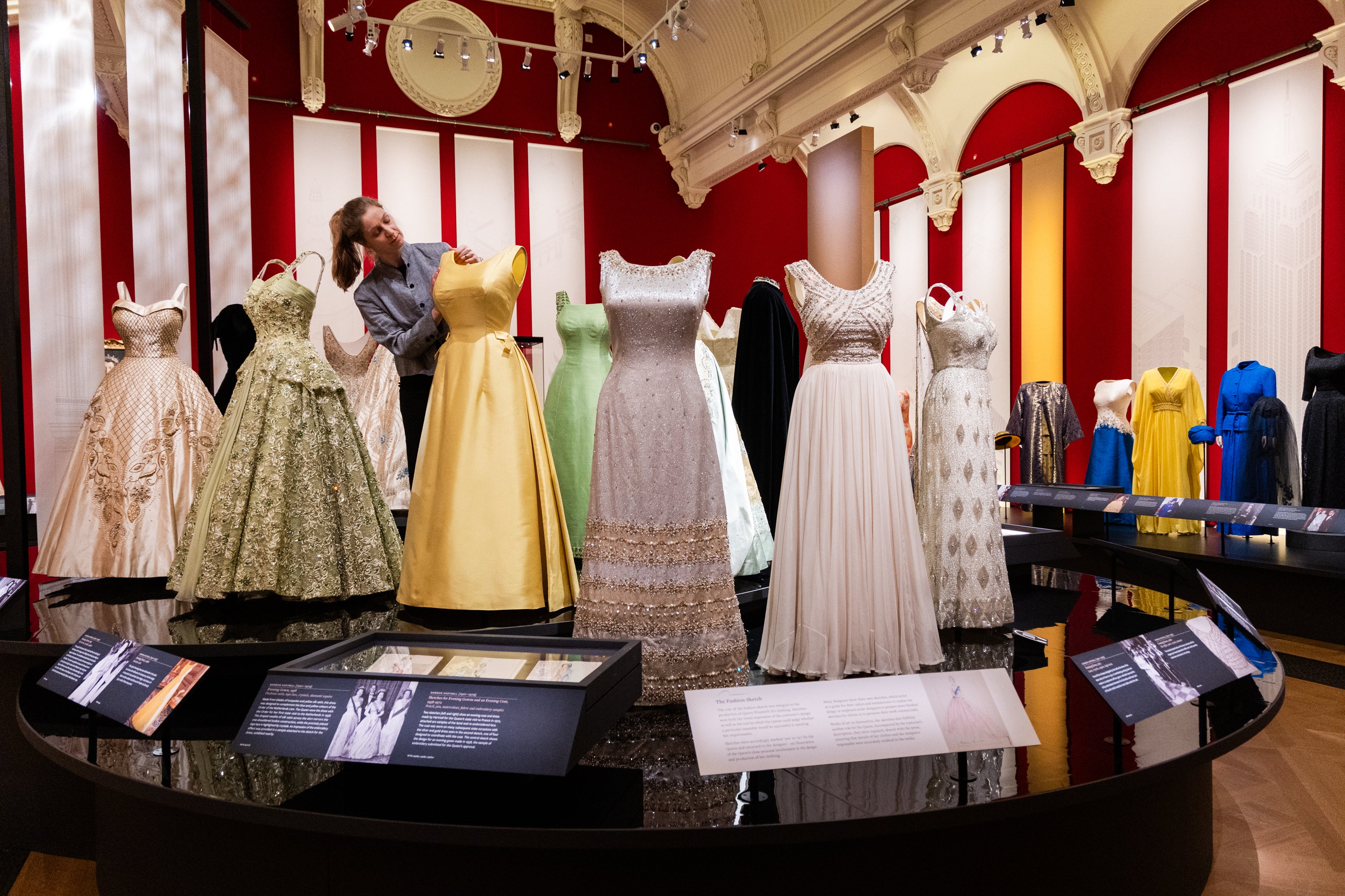 Queen Elizabeth II at Buckingham Palace. Evening gowns worn by the late monarch are on display at the Elizabeth: Her Life in Style exhibition