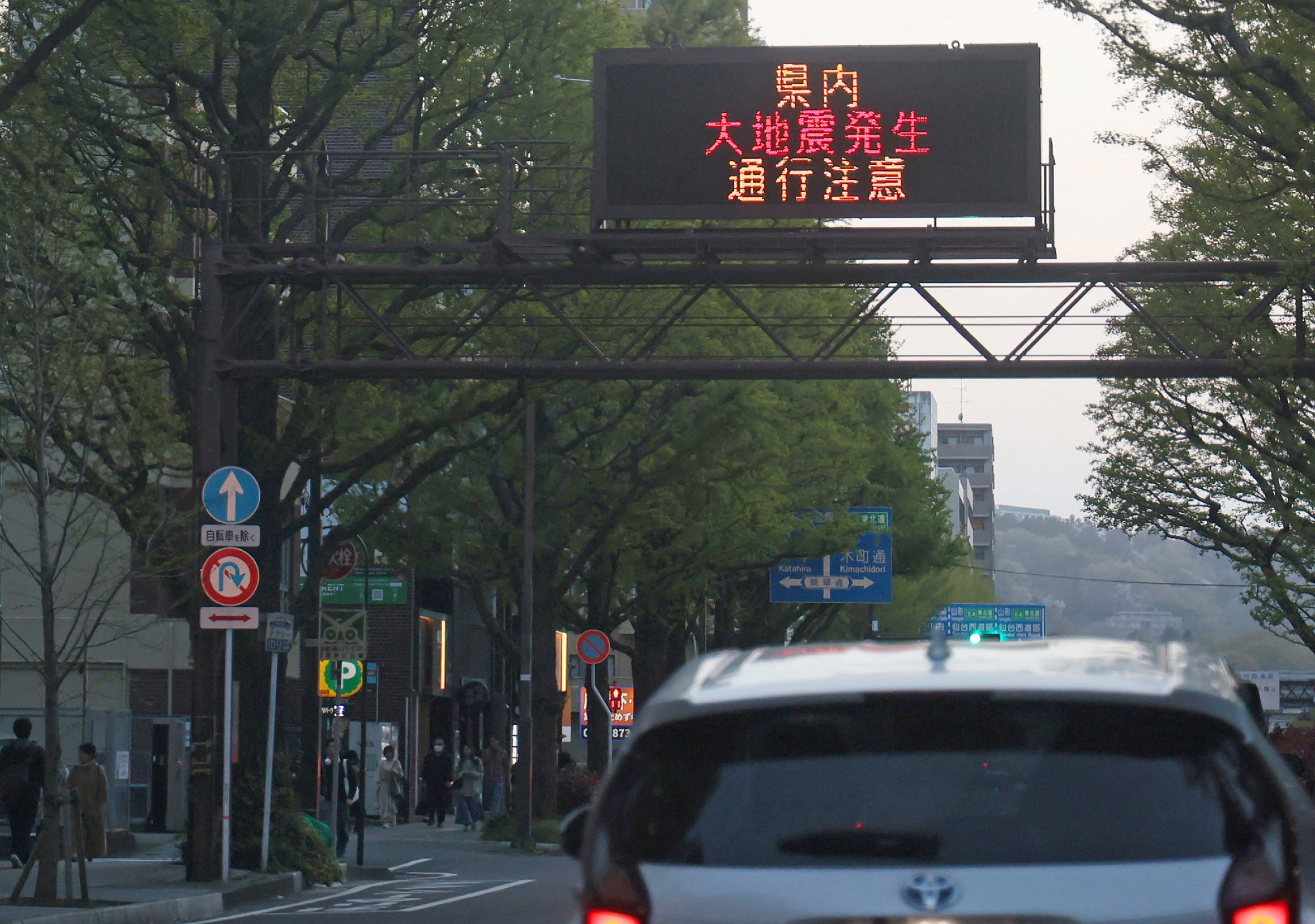An electronic bulletin board warning about the earthquake after hitting northern Japan in Sendai city of Miyagi prefecture