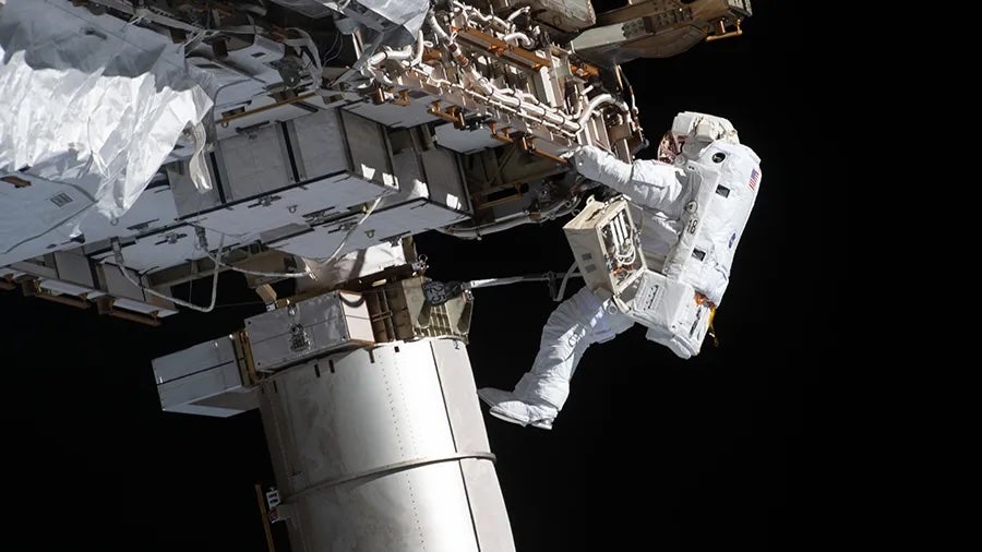 Artemis II astronaut Victor Glover works during a spacewalk in January 2021 wearing an old spacesuit