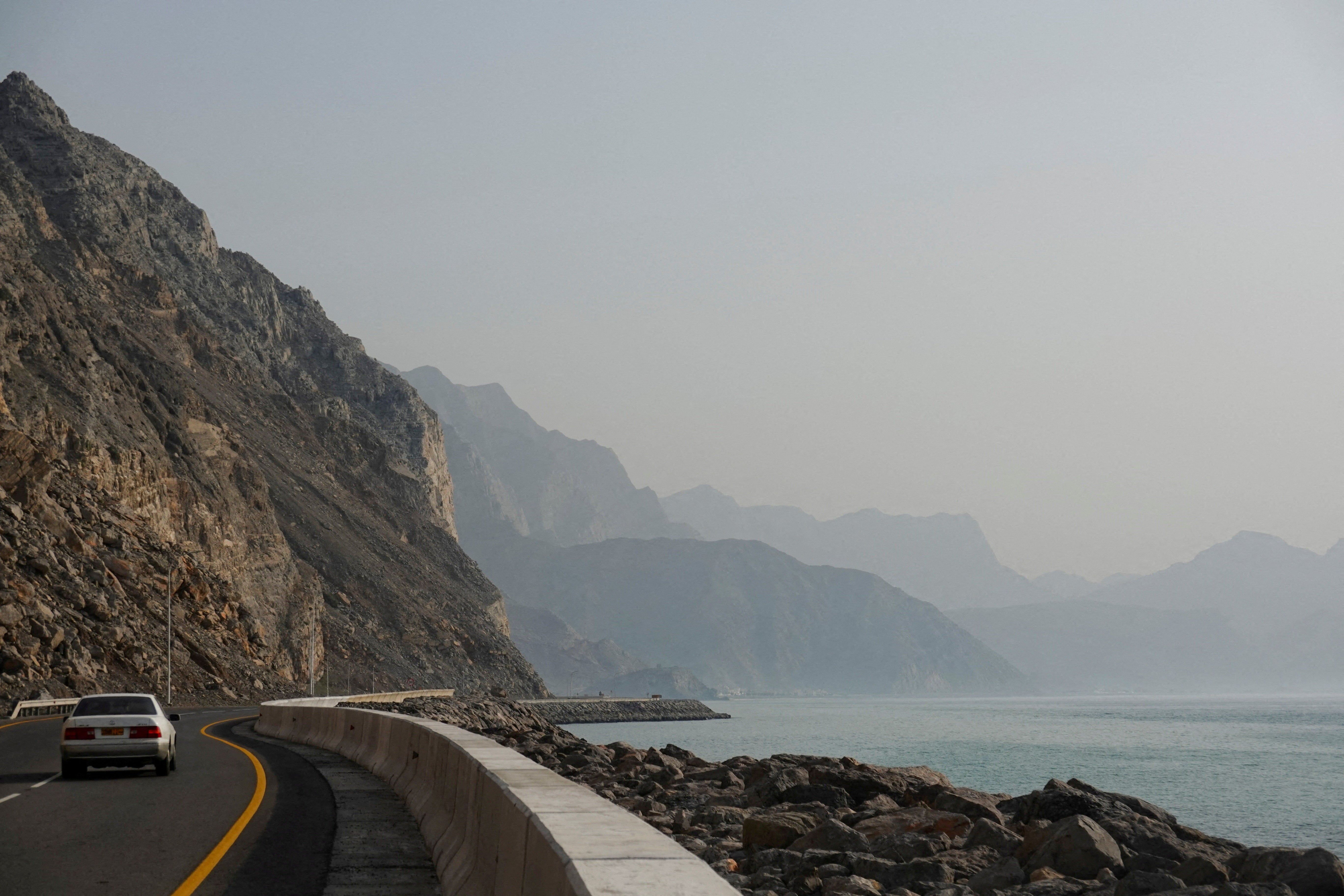 File. A car rides along the coast of Musandam overlooking the Strait of Hormuz amid the US-Israeli conflict with Iran