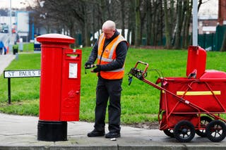 Royal Mail has pledged to meet new postal delivery targets by May next year